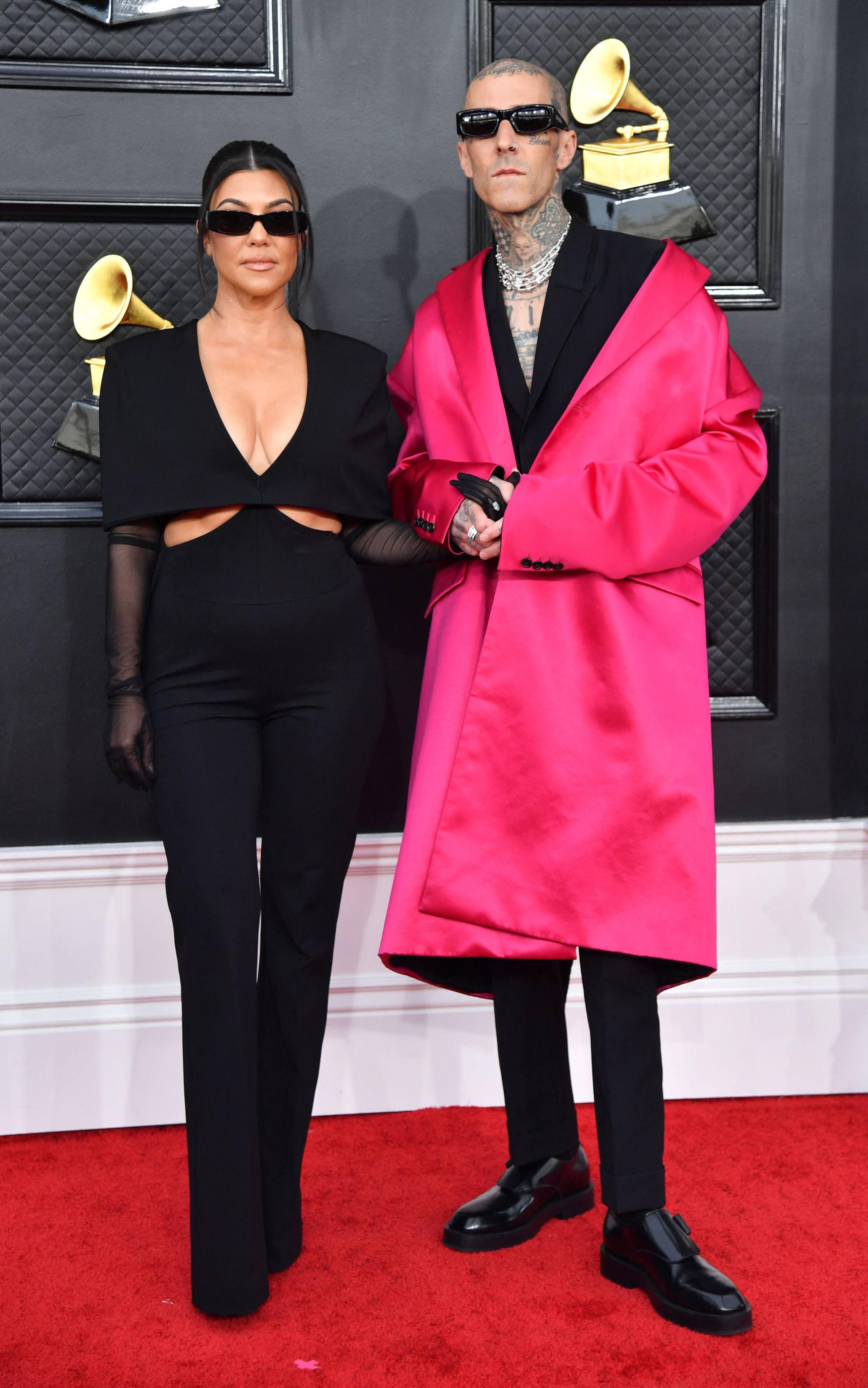 Kourtney Kardashian and musician Travis Barker didn’t excite with their outfits, despite the hot pink. Photo: AFP