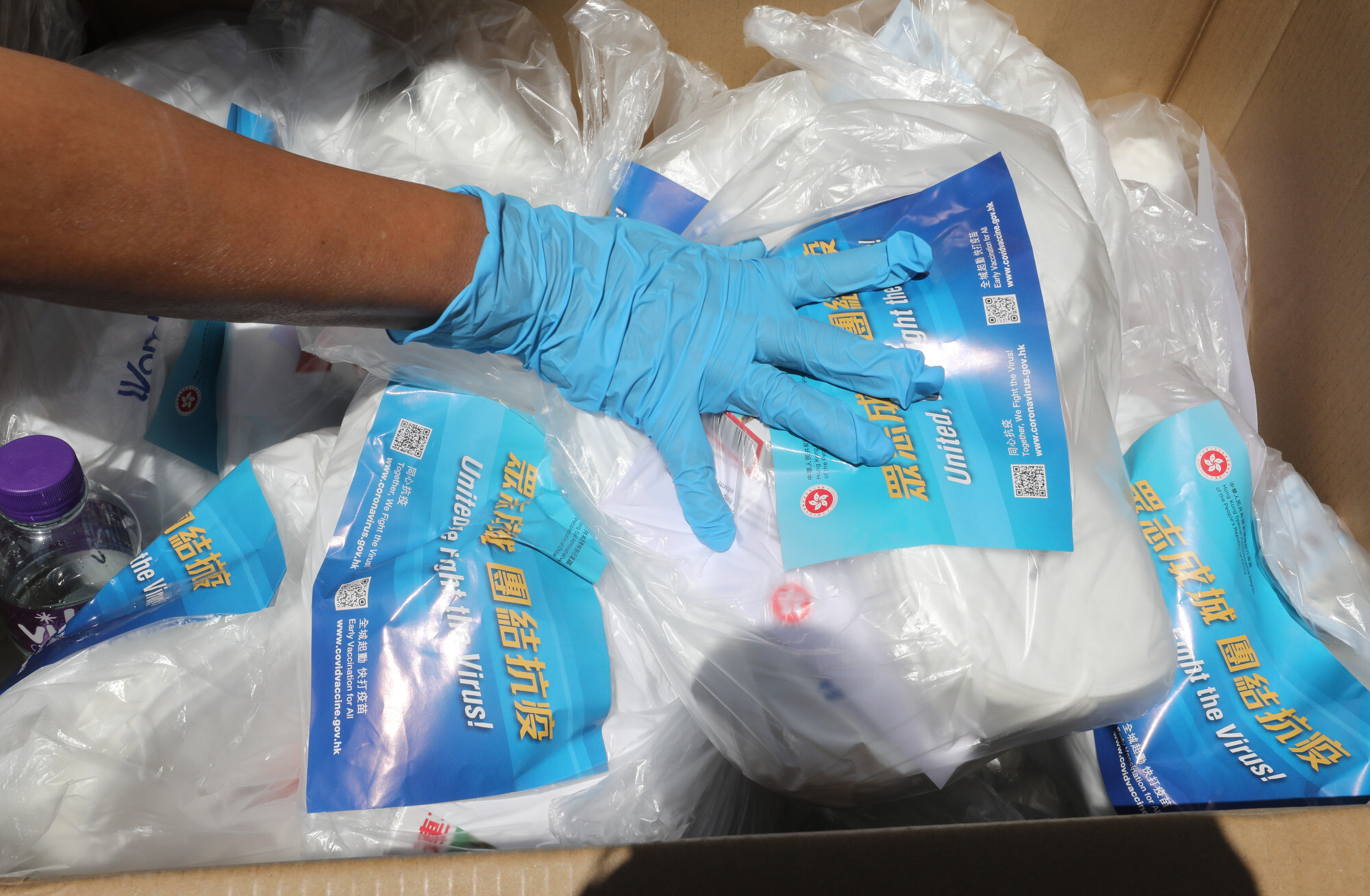Each anti-epidemic service bag contains 20 rapid tests, 20 KN95 masks and two boxes of proprietary traditional Chinese medicine. Photo: Jelly Tse