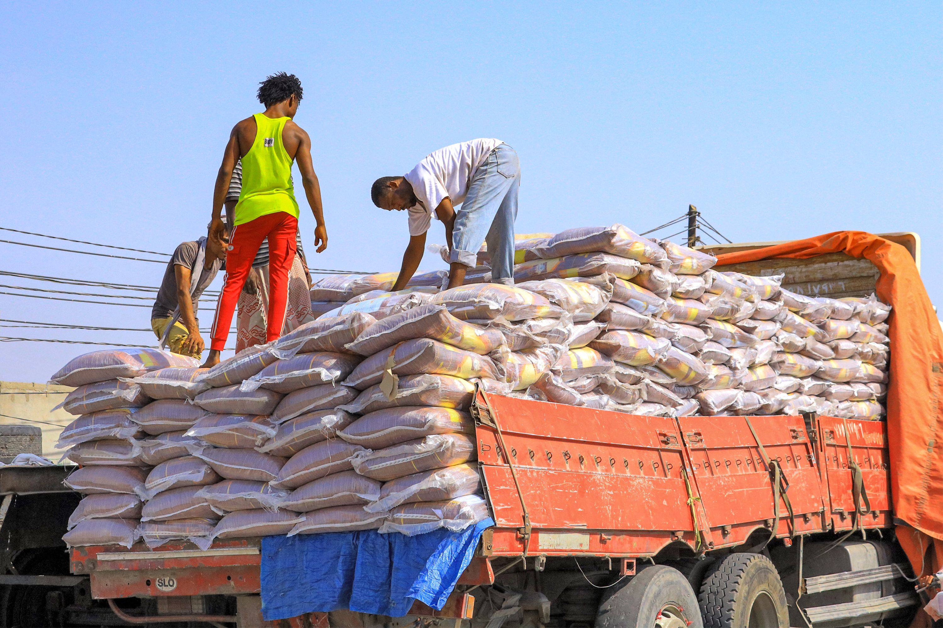 Workers load sacks of food supplies at the port of Hodeida in western Yemen on April 5. The nation relies on Ukraine for nearly a third of its wheat supply. Photo: AFP