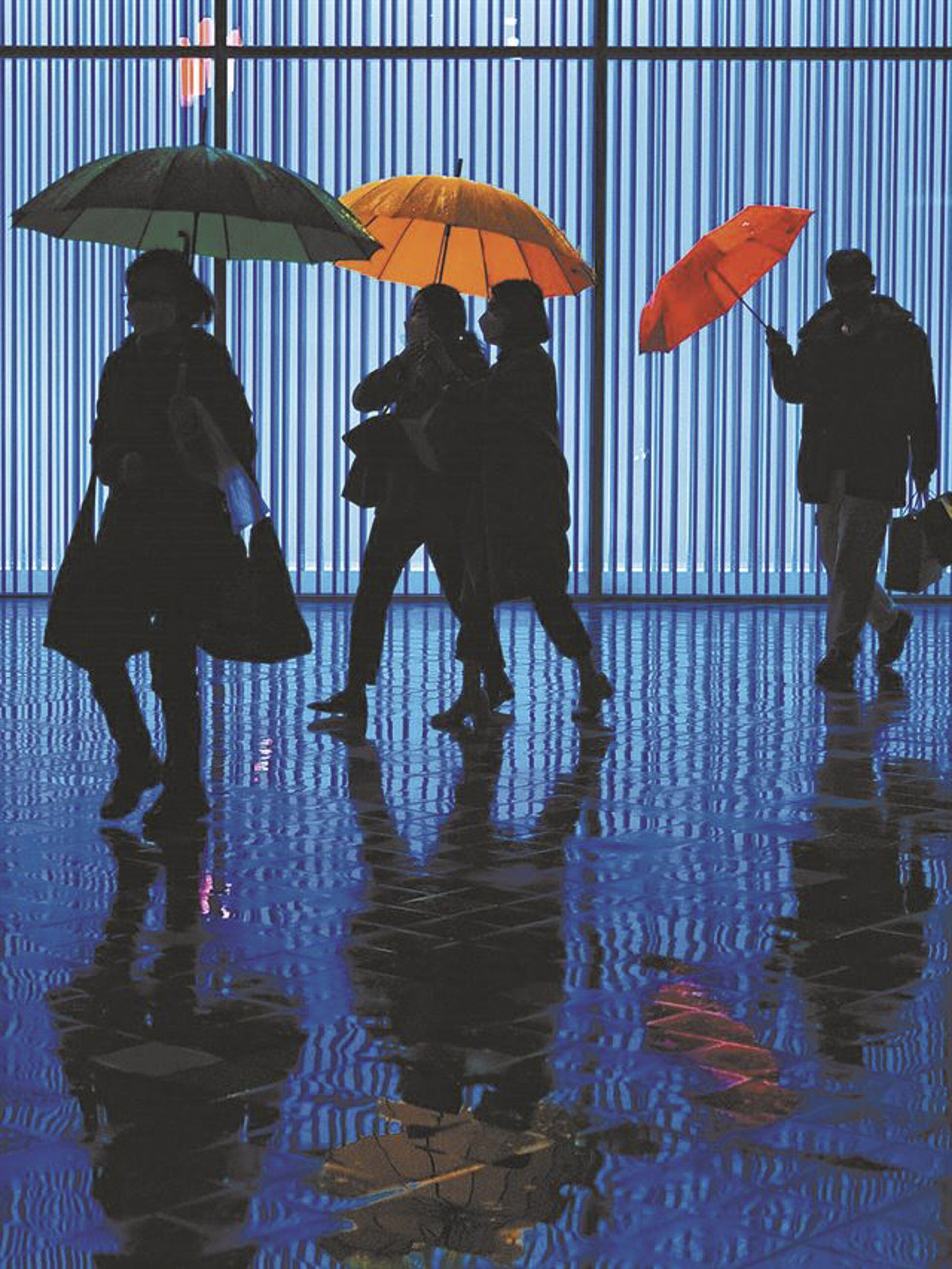 “Three Umbrellas” by street photographer Chae Kyung-wan, AKA K. Chae, one of the photos of South Korea’s capital that make up his “Not Seoul” exhibition. Photo: Courtesy of K. Chae.