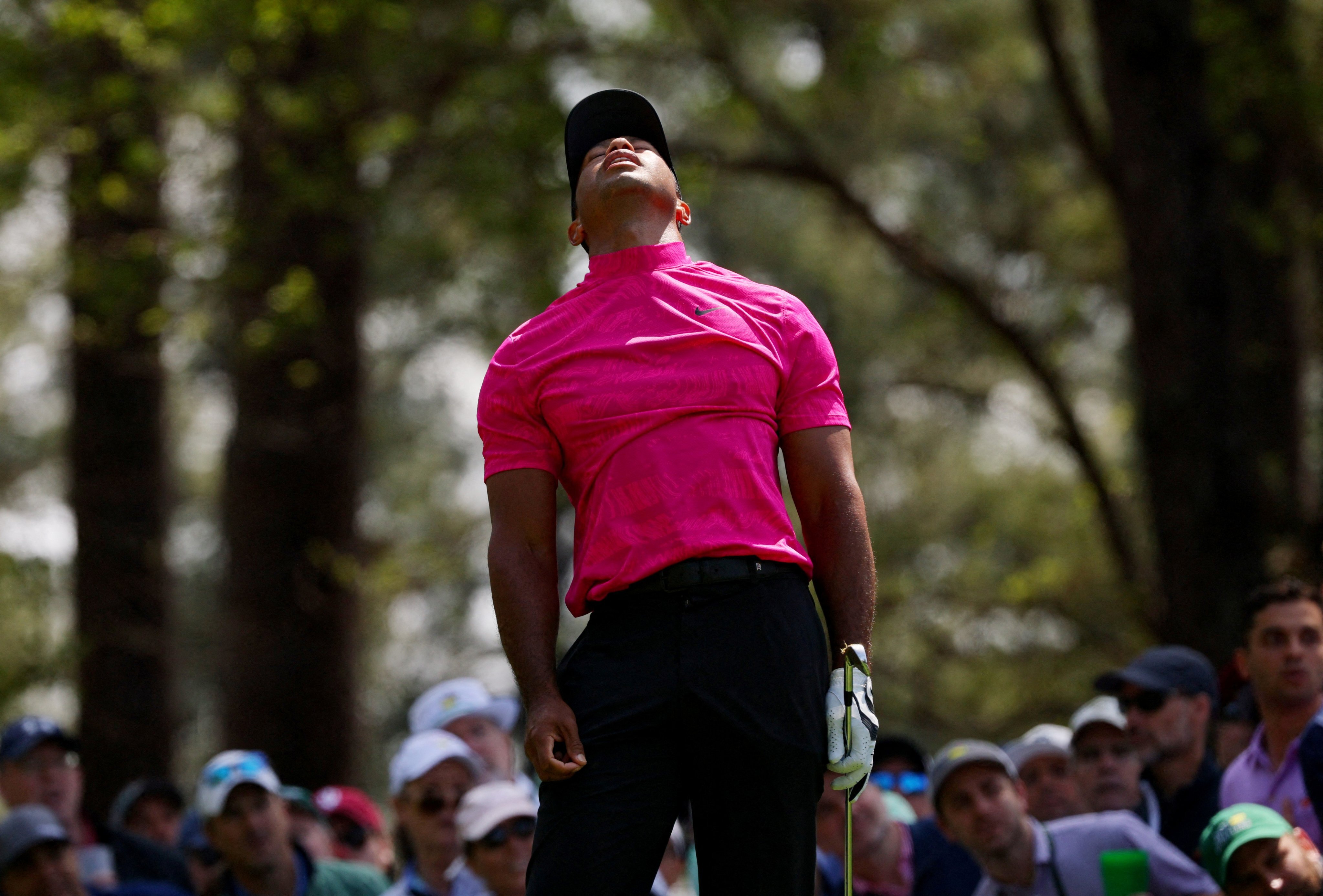 Tiger Woods reacts after his tee shot on the 4th during the first round of the Masters. Photo: Reuters