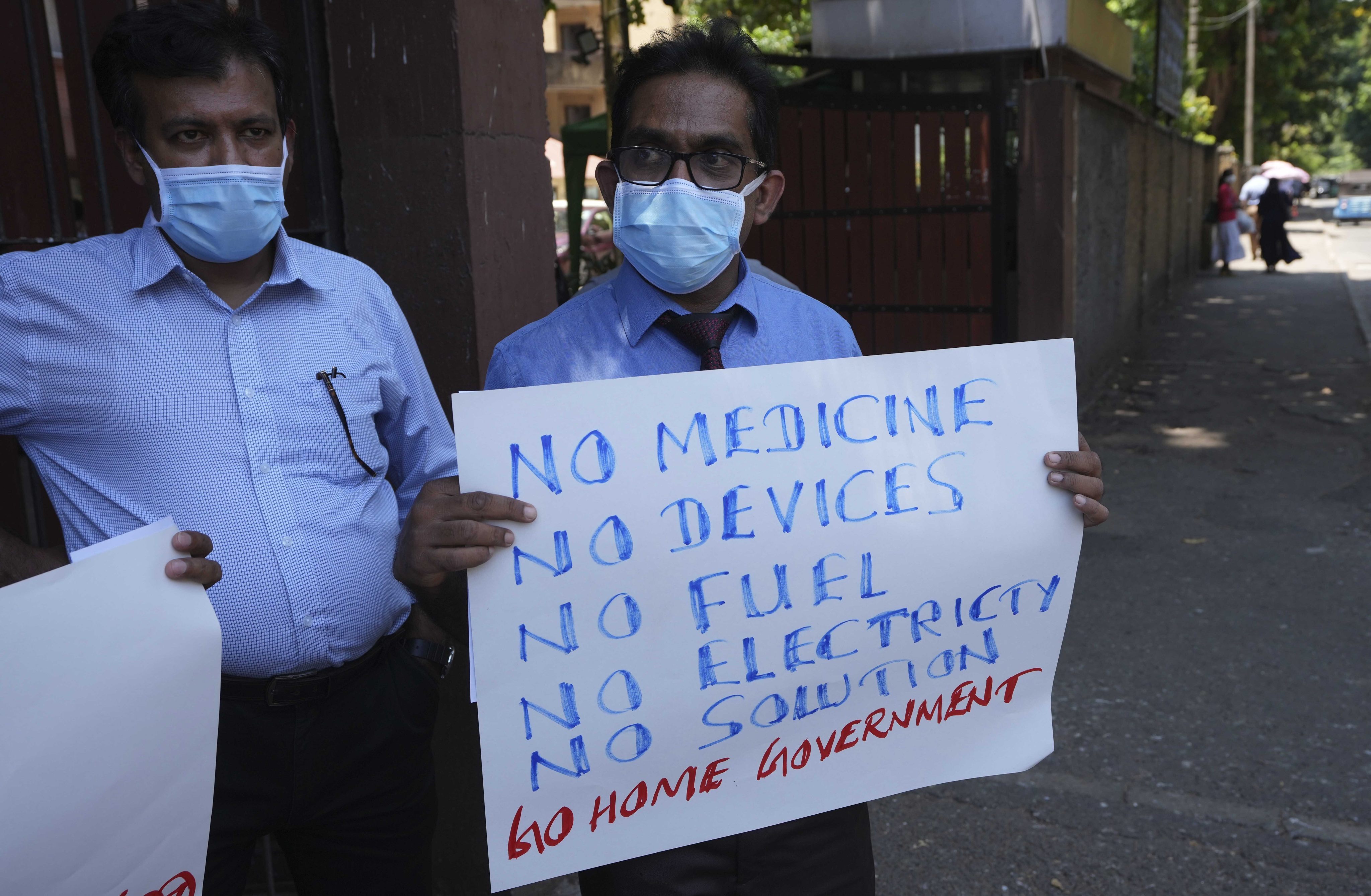 Sri Lankan government medical officers protest outside a hospital in Colombo. Professional medical organisations are warning that people will die as emergency treatment will soon not be possible if drugs and equipment are not received urgently. Photo: AP