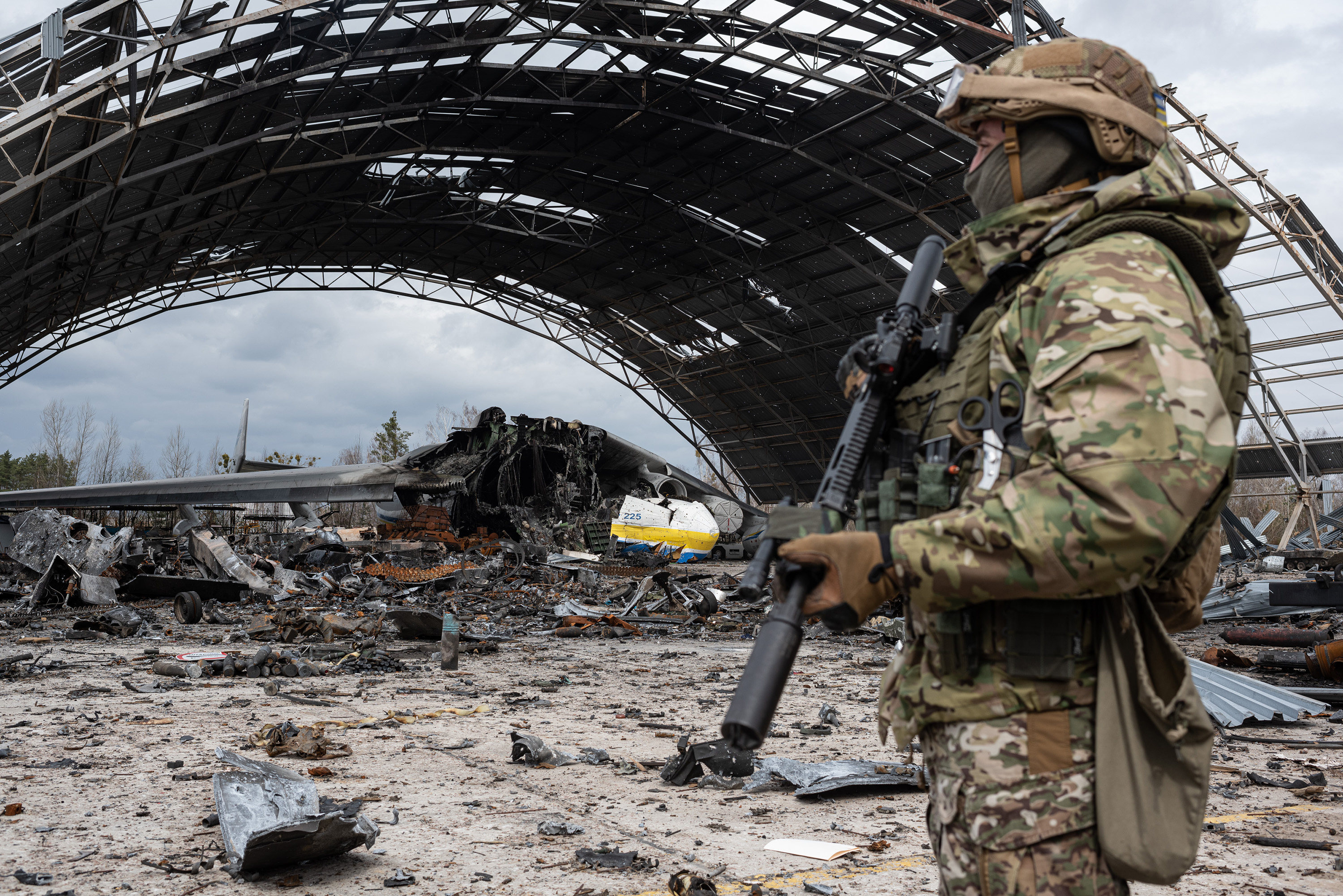 A Ukrainian soldier stands amid the devastation at Hostomel Airport on April 8. Photo: Getty Images