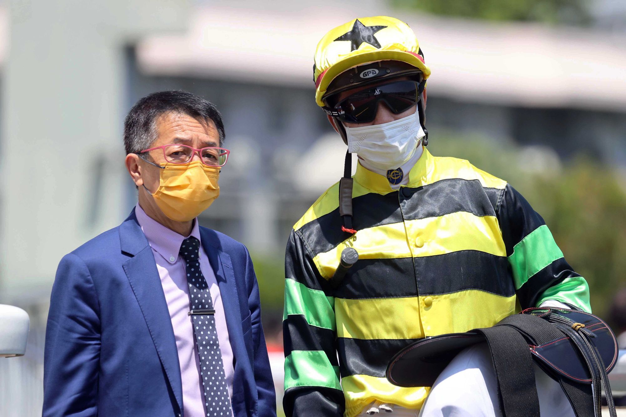 Trainer Me Tsui celebrates Dragon Kingdom’s win with jockey Derek Leung on Sunday. Photo: HKJC