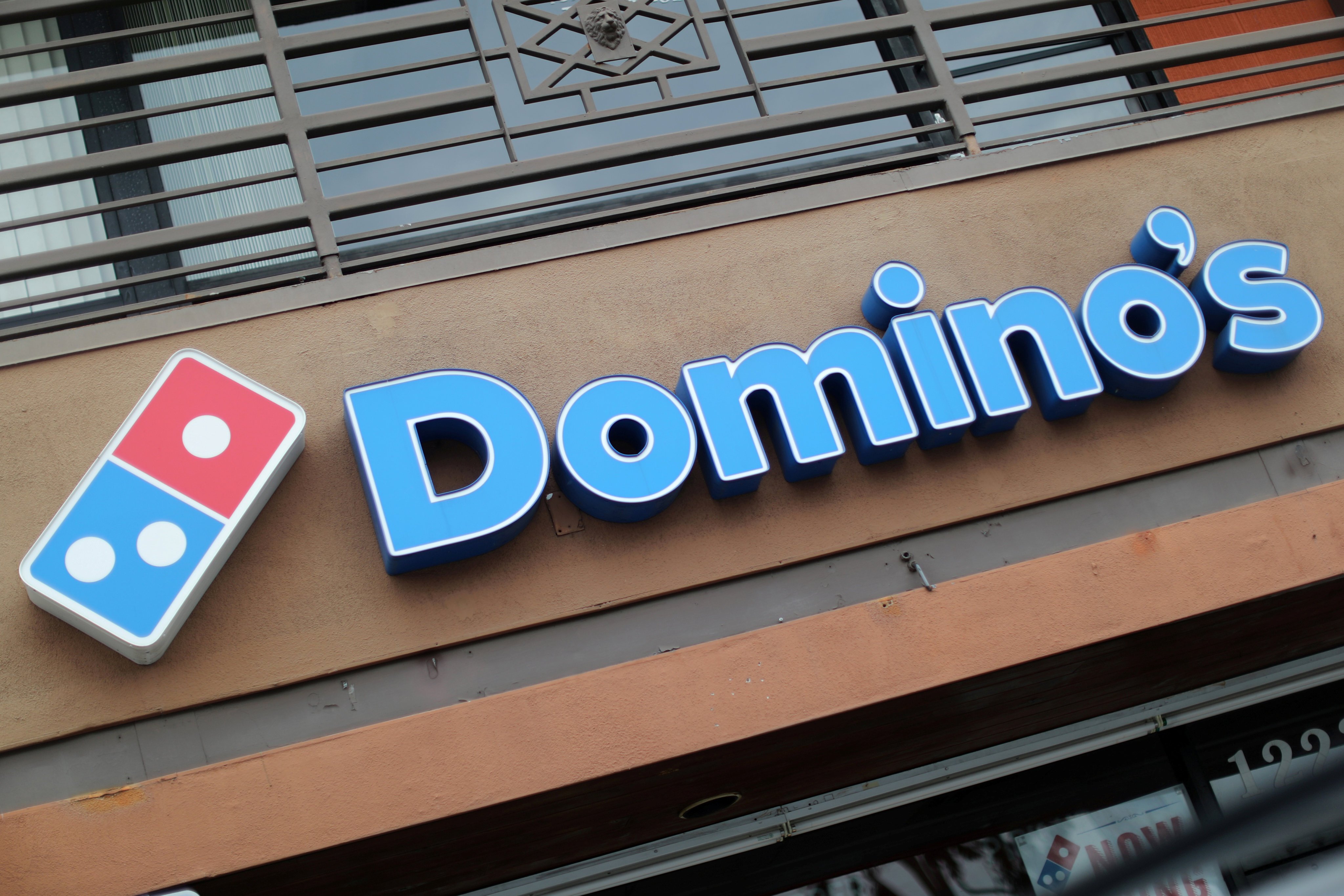 DPC Dash, which operates Domino’s in China, said it plans to use the proceeds of its IPO to open 300 new stores in the country by 2023. Photo: Reuters