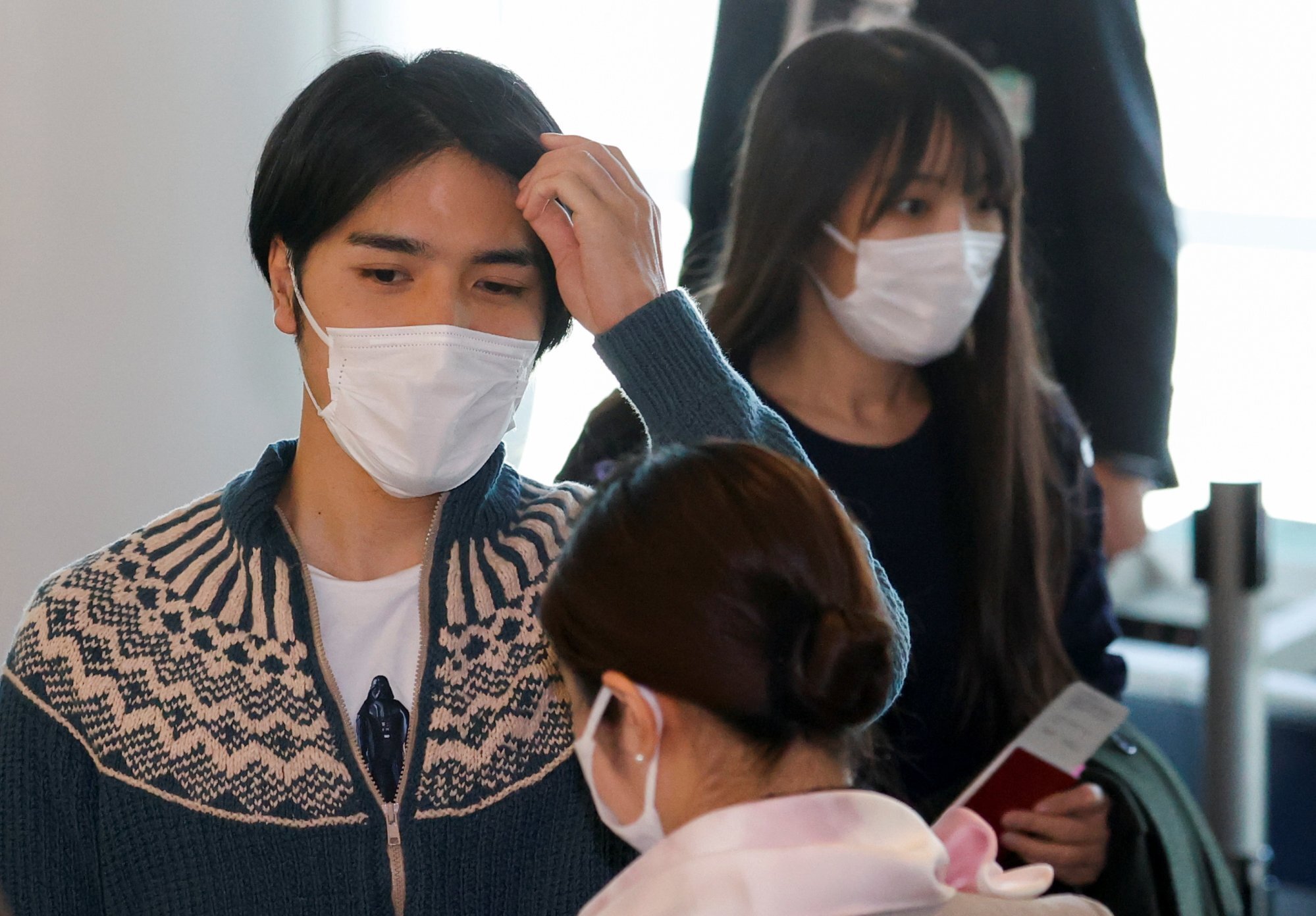 Japan’s Princess Mako and her newly married husband Kei Komuro are seen before they board a flight bound for New York to start their new life in November 2021. Photo: Reuters
