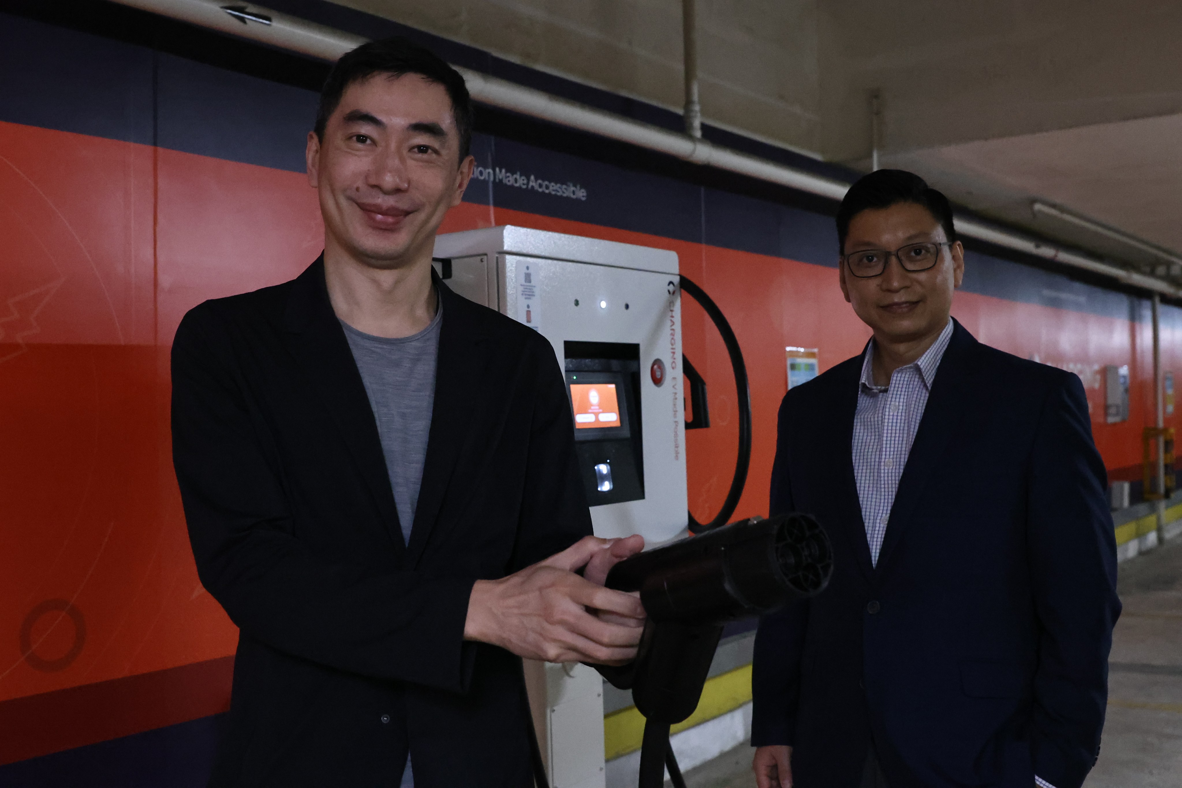 Cornerstone’s CEO, Vincent Yip, left, and CFO, Barry Cheung, at an EV charging facility in Hong Kong’s Shek Yam Shopping Centre. Photo: KY Cheng