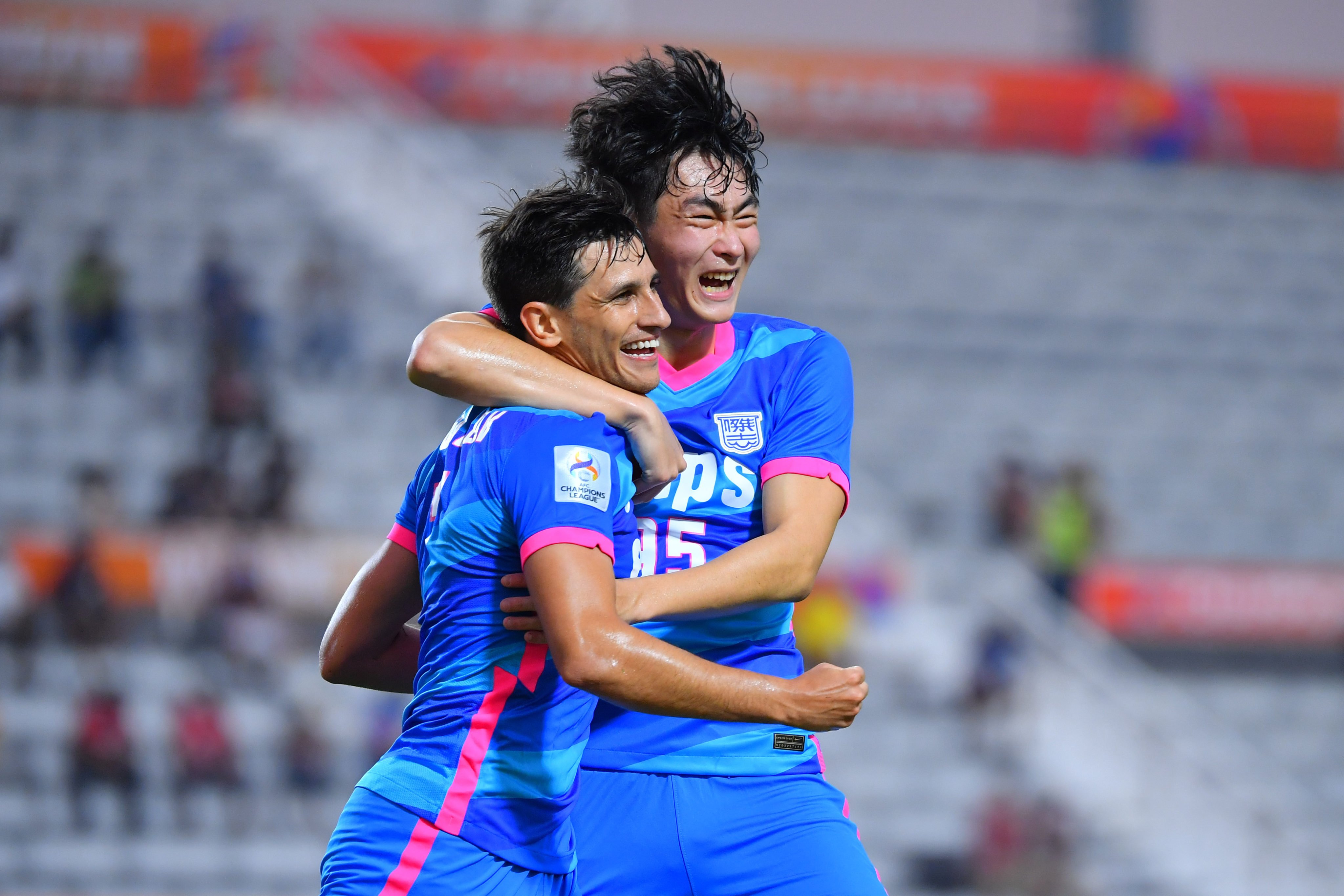 Kitchee midfielder Ruslan Mingazov (left) with defender Shinichi Chan after scoring against Chiangrai United in their AFC Champions League opener. Photo: Kitchee