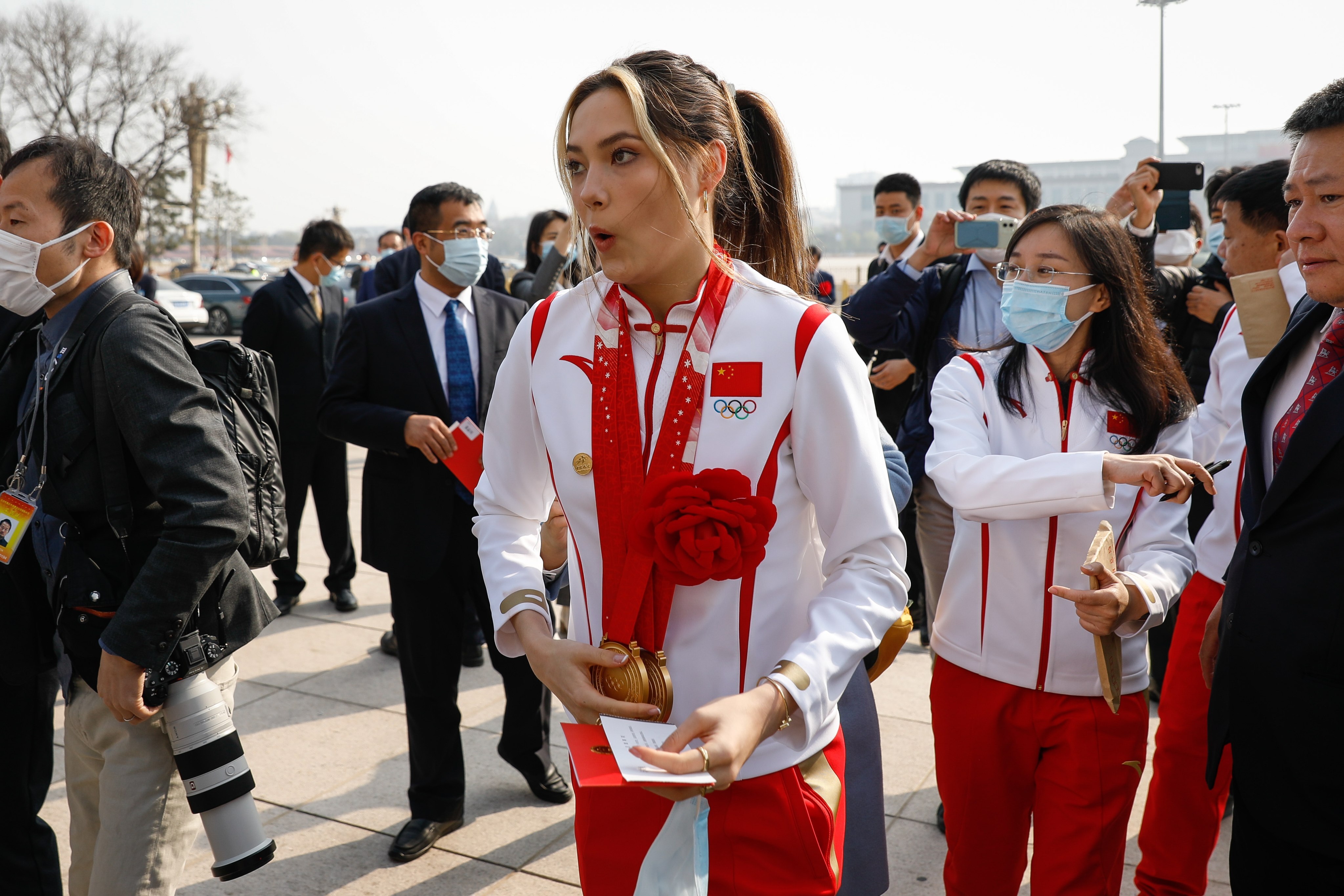 Chinese Olympian Eileen Gu reacts after being mobbed by fans and journalists during her arrival at the awards ceremony for the Beijing 2022 Winter Olympic and Paralympic Games at the Great Hall of the People on April 8, 2022. Photo: EPA-EFE/Mark R. Cristino