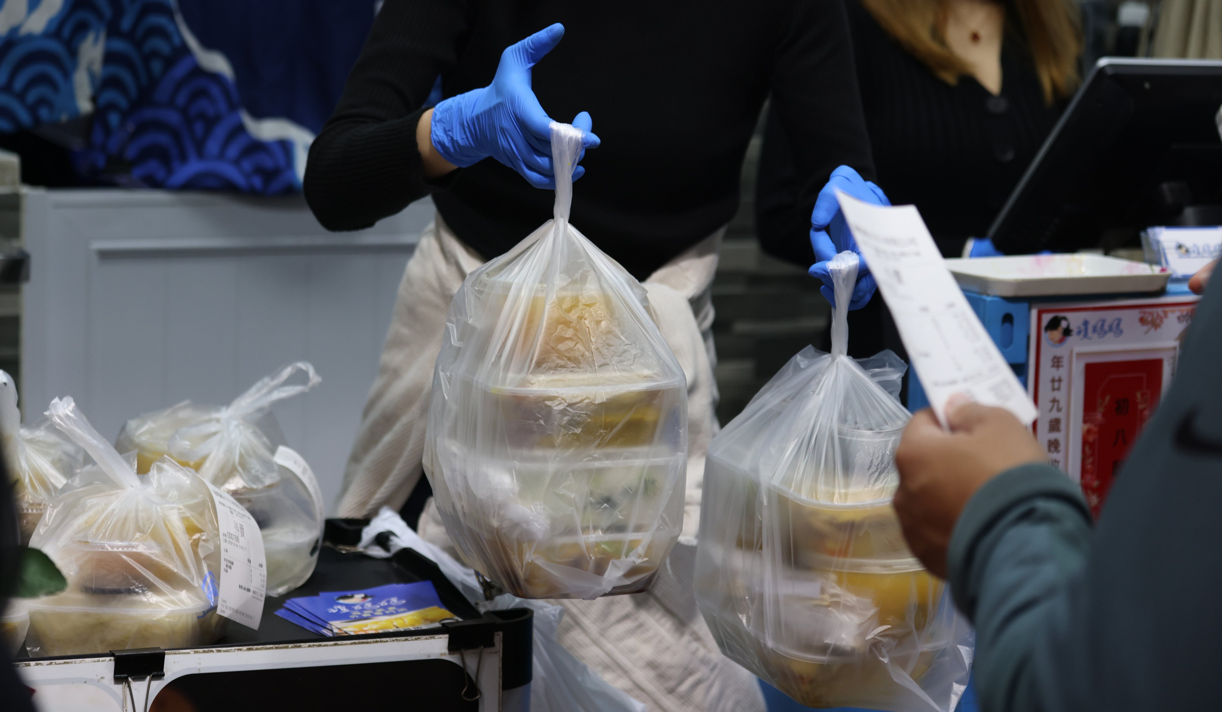 Takeaway food order is a popular choice amidst the fifth wave of coronavirus outbreak. Pictured in Wan Chai. Photo: Nora Tam