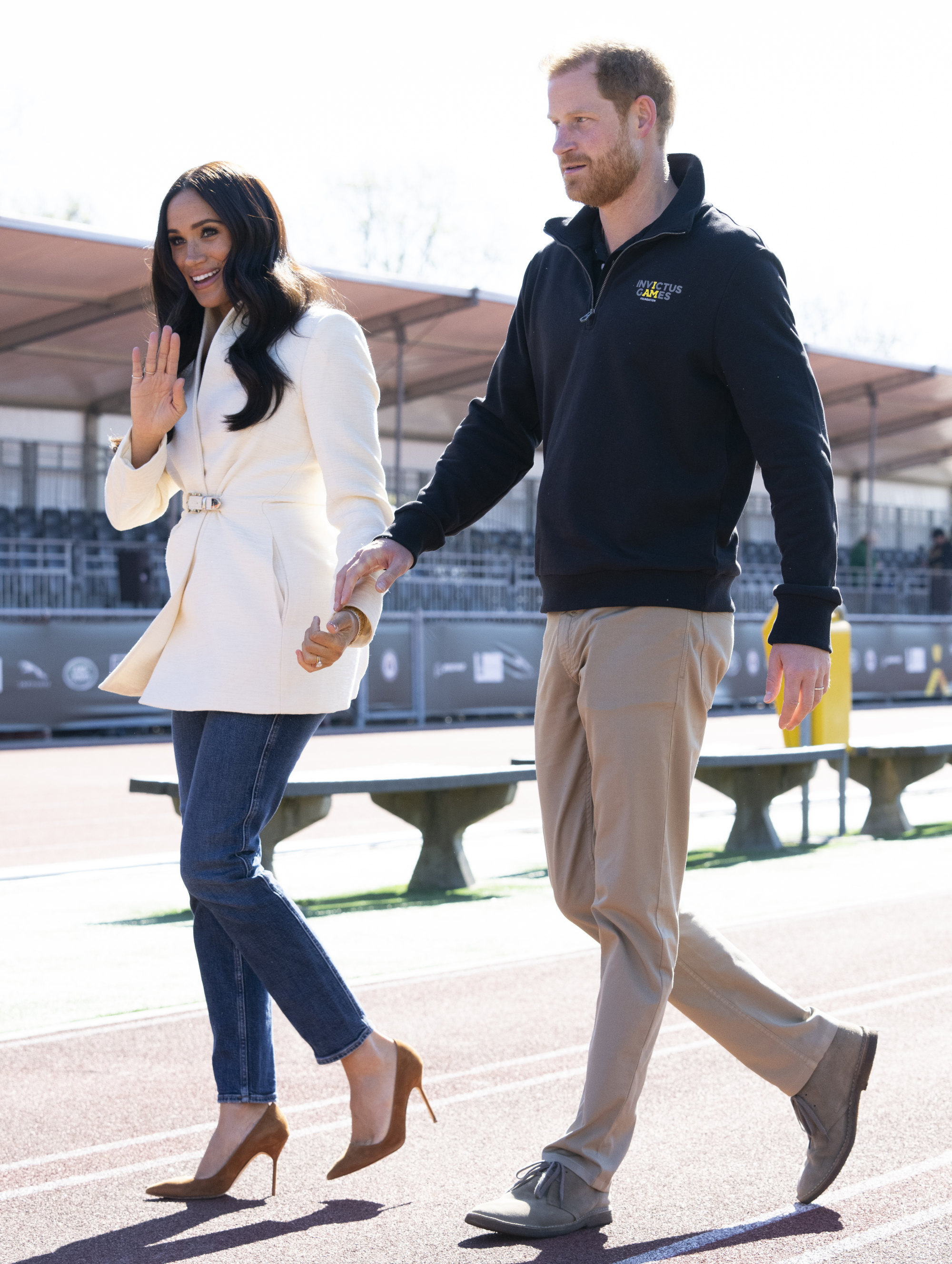 Meghan Markle opts for comfy-looking designer ensemble - including $770  Valentino flats and a $2,650 Goyard tote - as she jets to join Prince Harry  ahead of Invictus Games