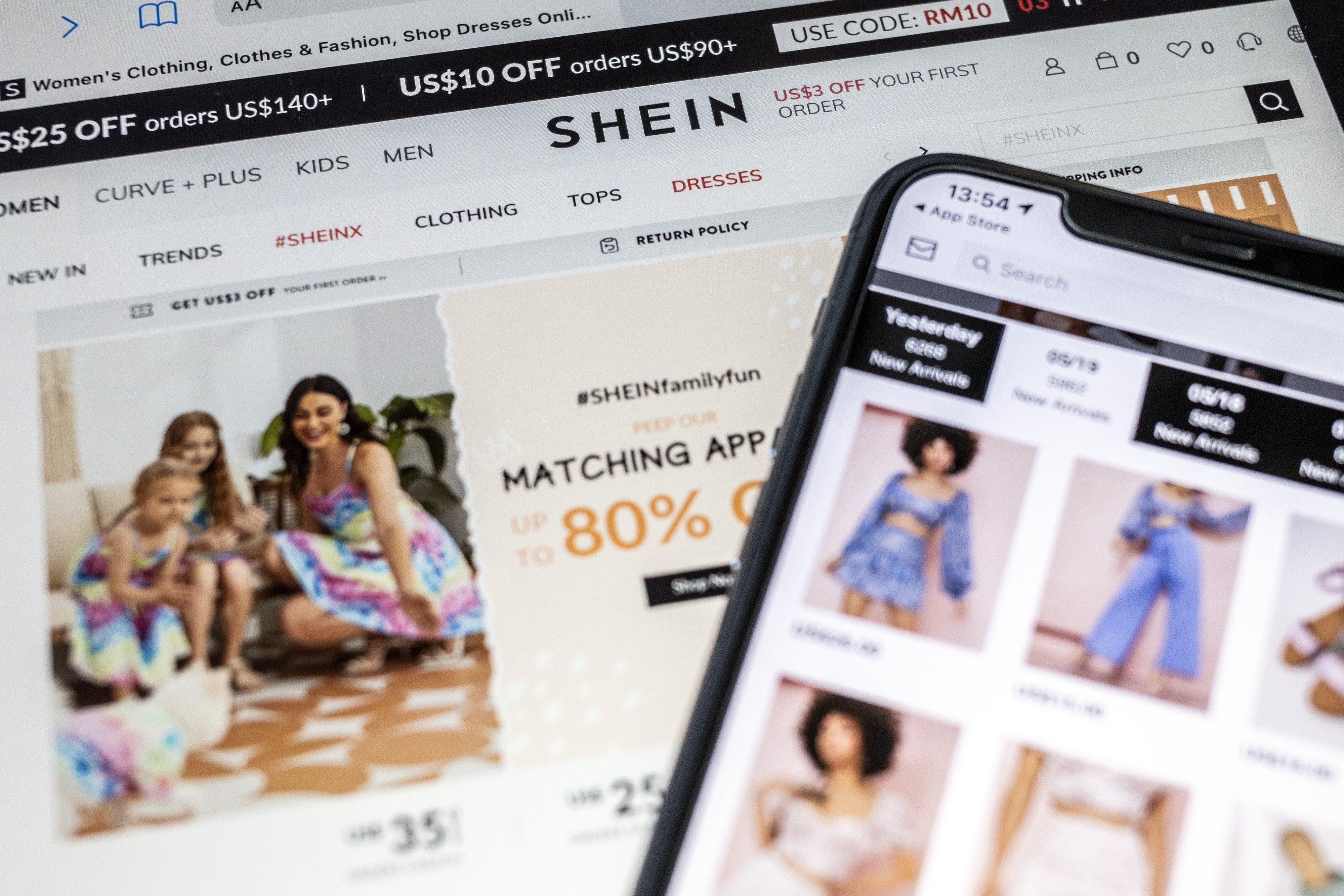 The SheIn application and website arranged on a smartphone and a tablet in Hong Kong, China, on Friday, May 21, 2021. Photo: Bloomberg