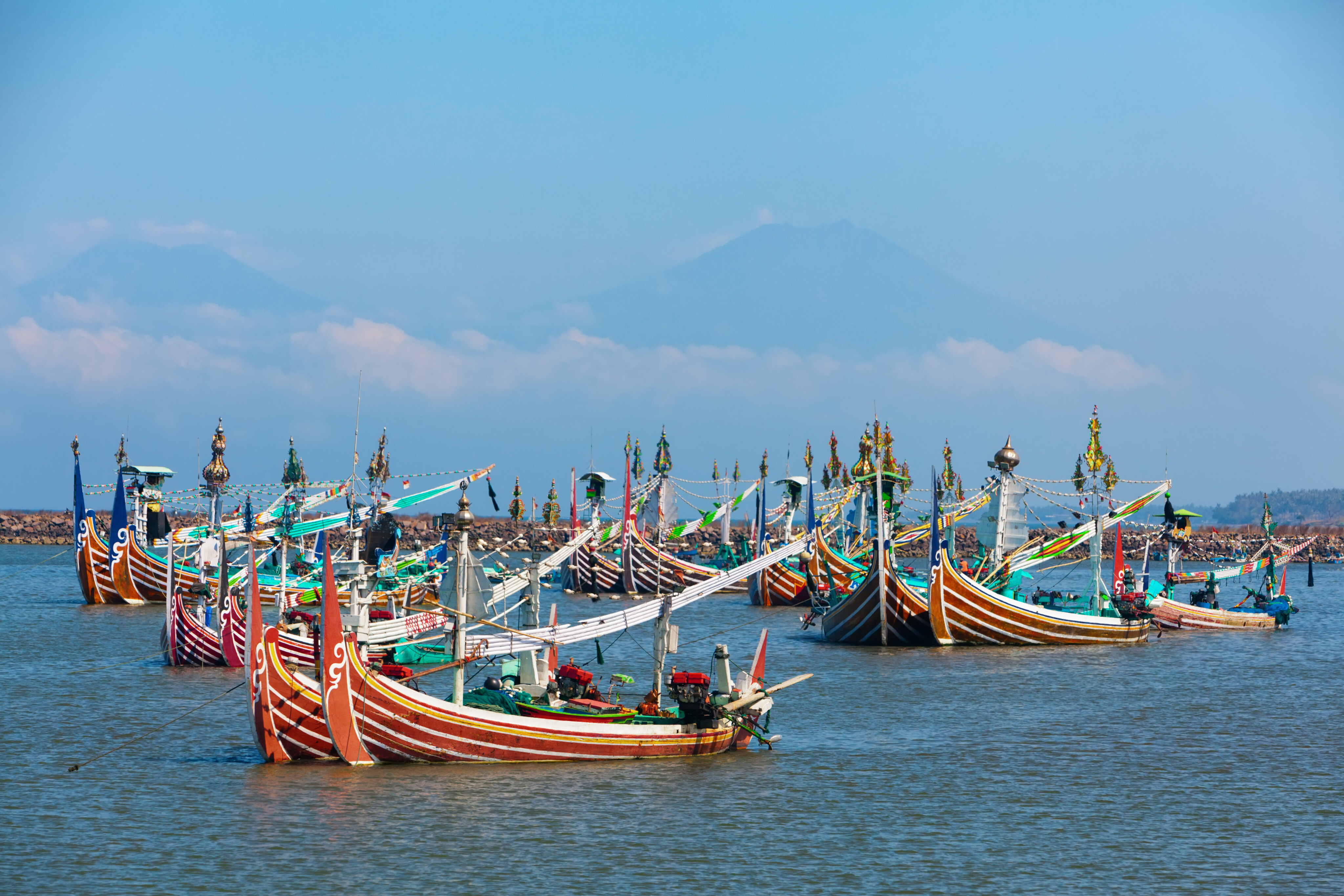 Multicoloured fishing boats moor near the village of Perancak on the west coast of the Indonesian island of Bali. Photo: Getty Images / iStockphoto