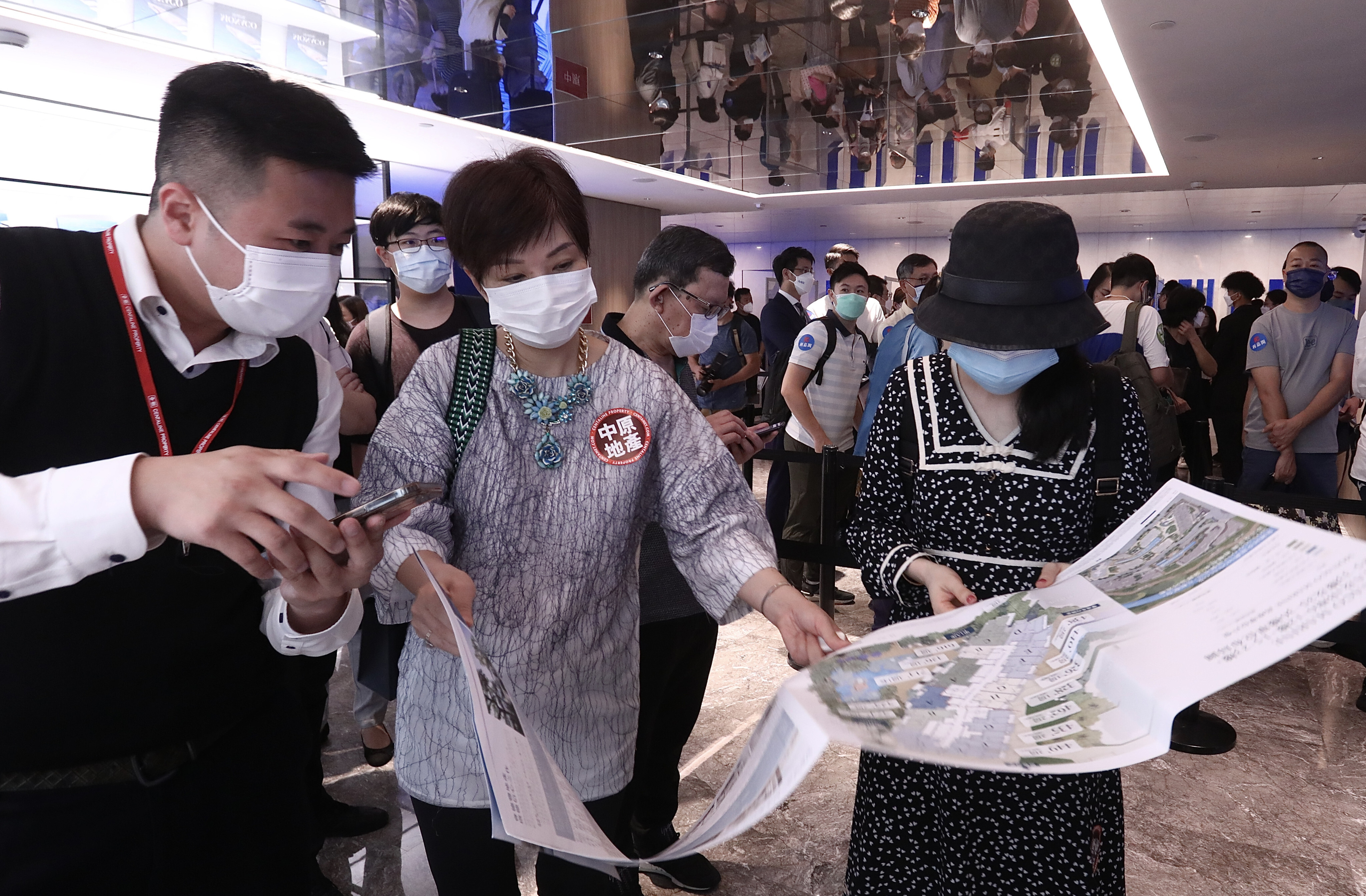Buyers queueing for Wheelock Properties’ Monaco Marine apartments in Kai Tak at the developer’s sales office at the Prince Hotel in Tsim Sha Tsui on 23 April 2022. Photo: Jonathan Wong