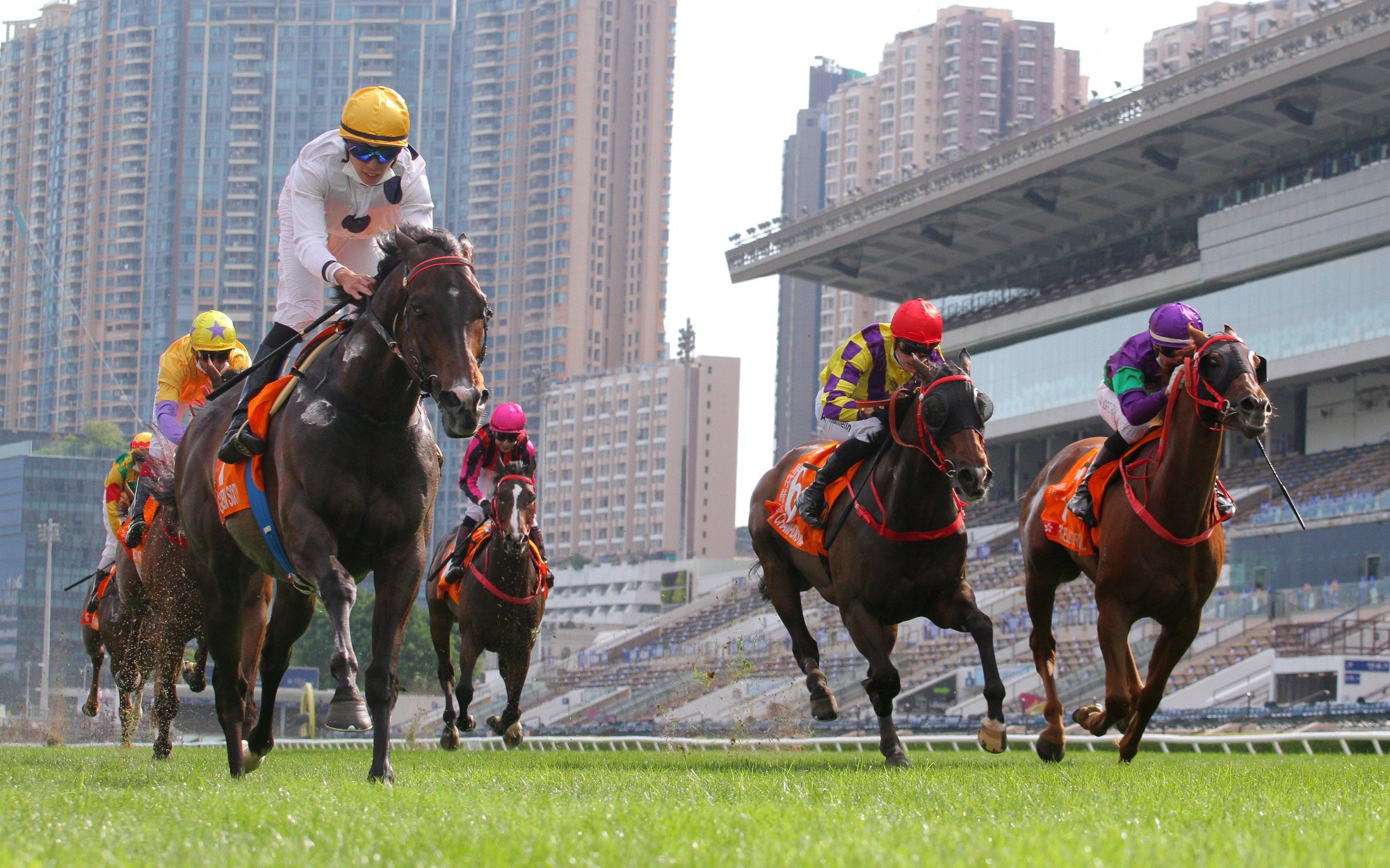 Golden Sixty (left) proves too strong for his rivals in the Champions Mile.