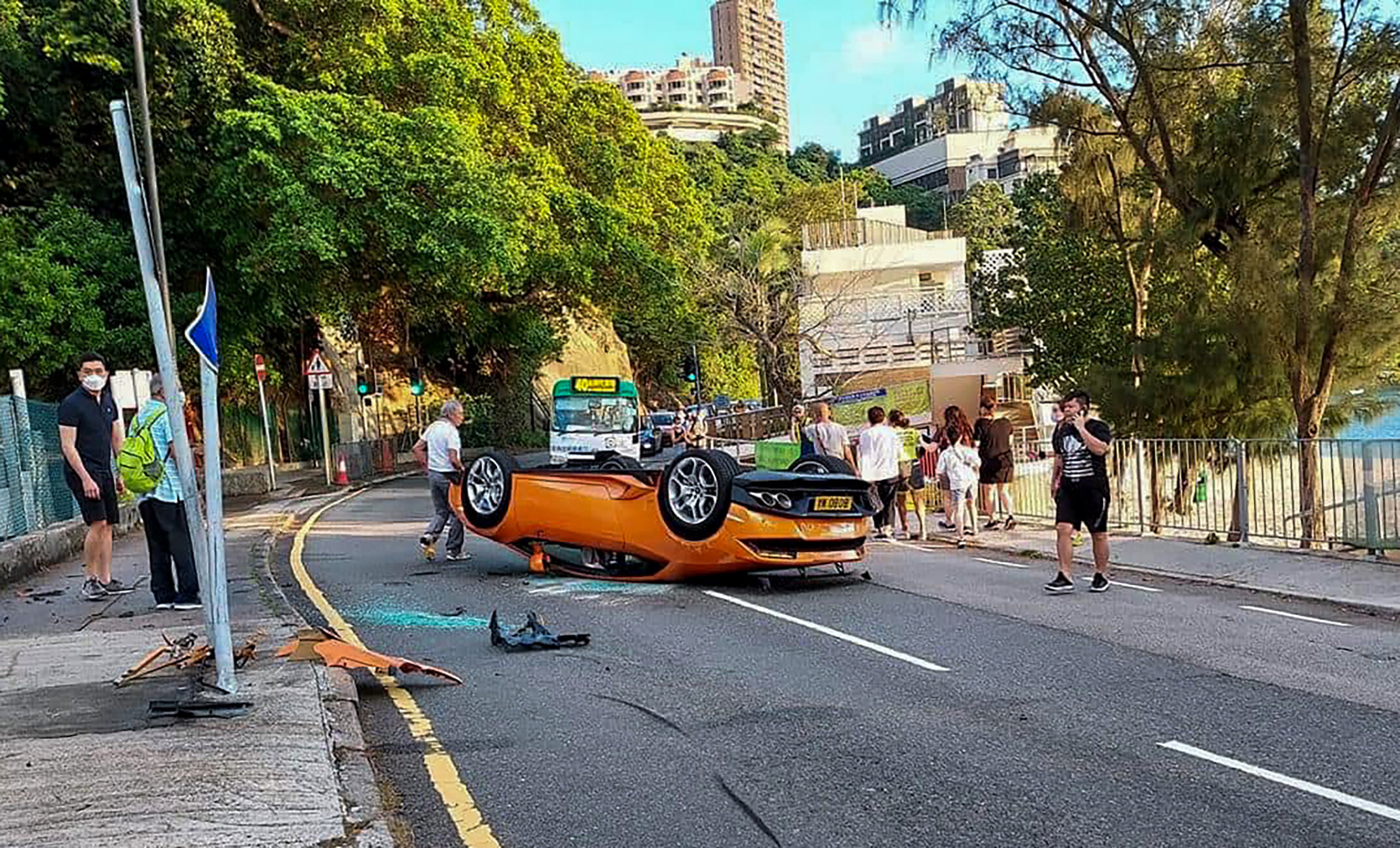Hong Kong man and passenger both walk away with arm injuries after Lamborghini  crashes and flips over | South China Morning Post