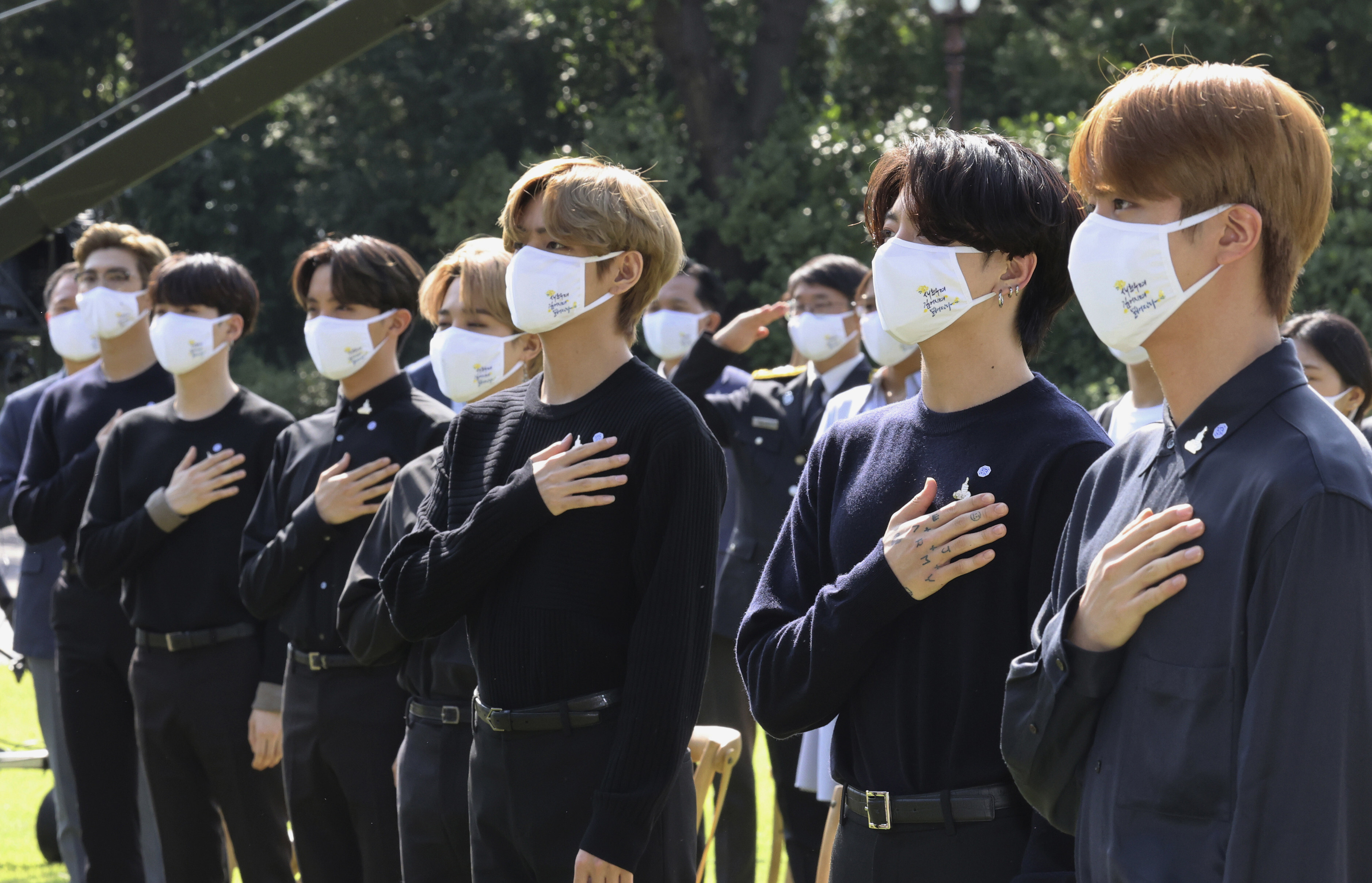 K-pop group BTS salutes to their national flag during a ceremony marking the National Youth Day at the presidential Blue House in Seoul. File photo: Yonhap via AP 