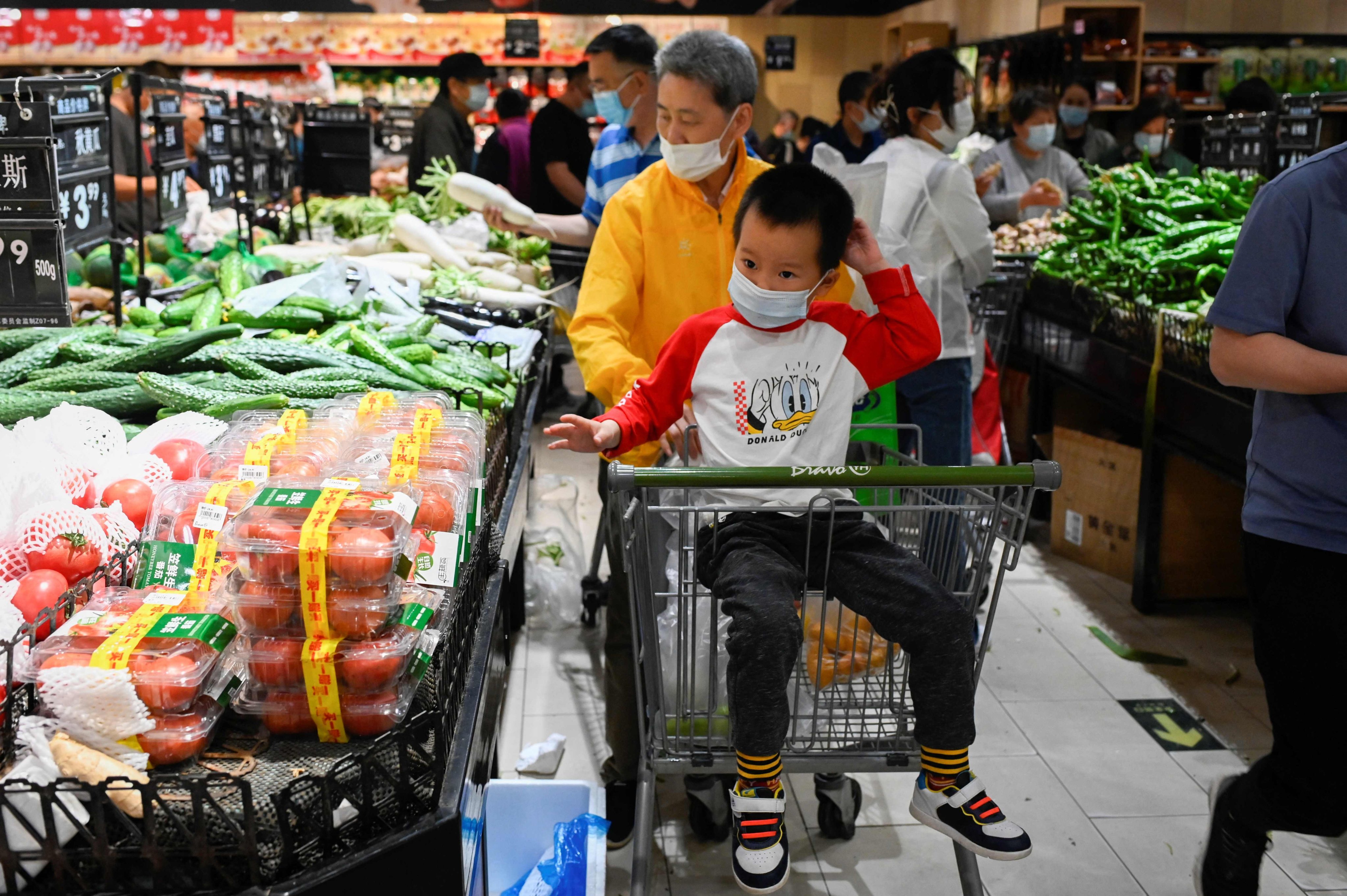 People shop at a supermarket in Beijing on April 25. China’s economy is growing well below the pace recorded from 2010 to 2019, removing a potential cushion that supported global growth during previous crises. Photo: AFP