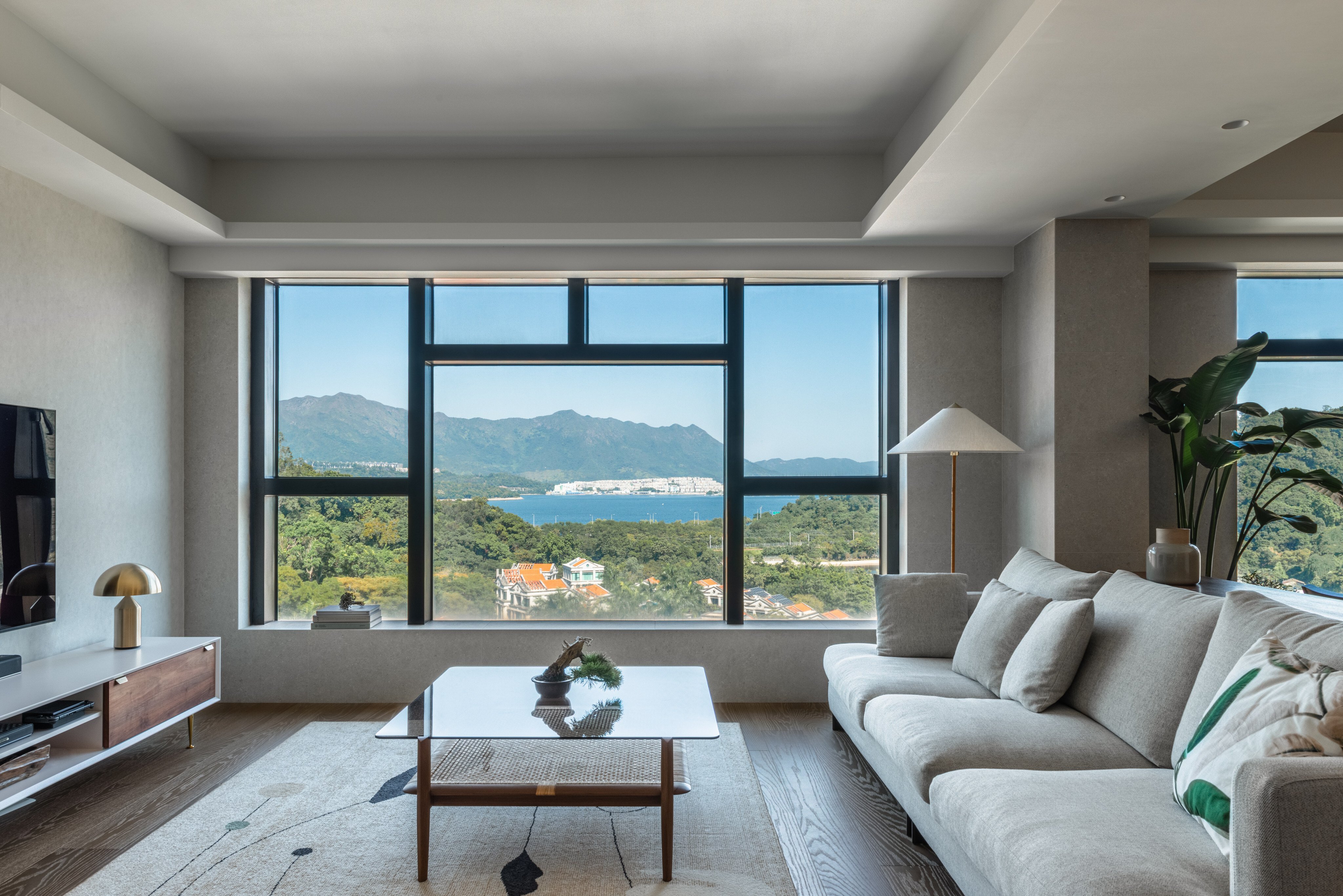 A couple’s flat in Tai Po, in the New Territories in Hong Kong, was transformed into a tranquil retreat. The living room windows have no blinds or curtains to make the most of the view of Plover Cove. Photo: YC Chen