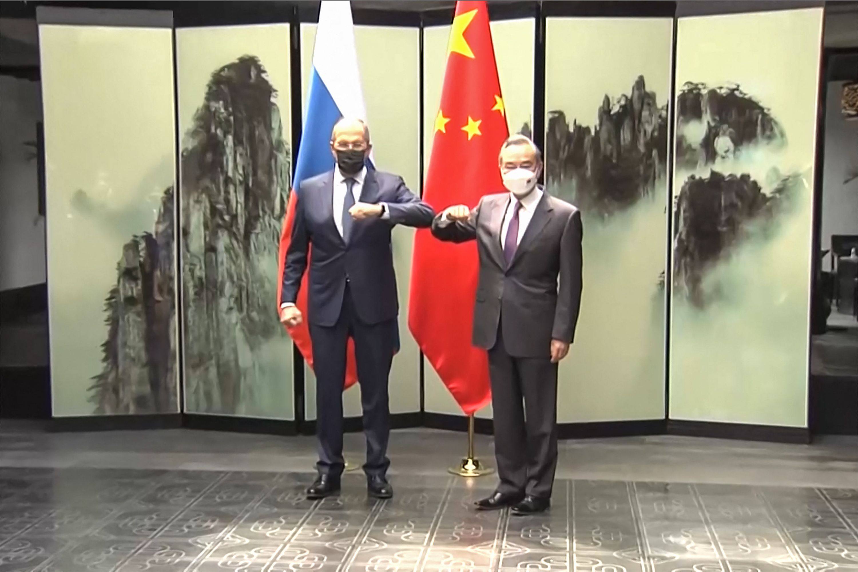 This screengrab taken on March 30, 2022 from video by state broadcaster China Central Television (CCTV) via AFPTV shows  
Russian Foreign Minister Sergei Lavrov (L) meeting his Chinese counterpart Wang Yi during his first visit to China since Moscow launched its invasion of Ukraine in February. Photo: AFP