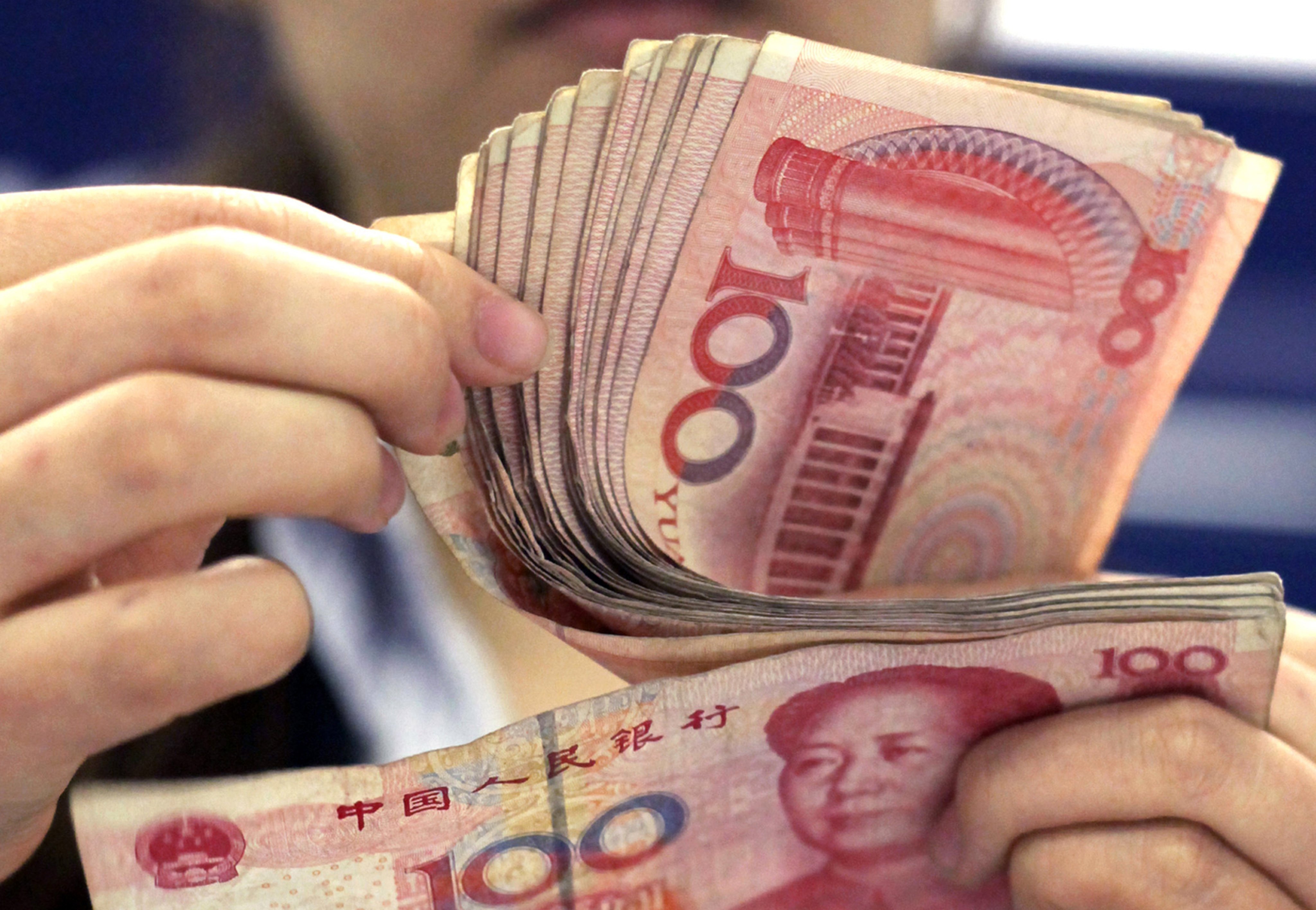 With few other signals that the PBOC is uncomfortable with a softer yuan, market participants remain uncertain whether the bank has a clear “red line” for depreciation. Photo: AP
