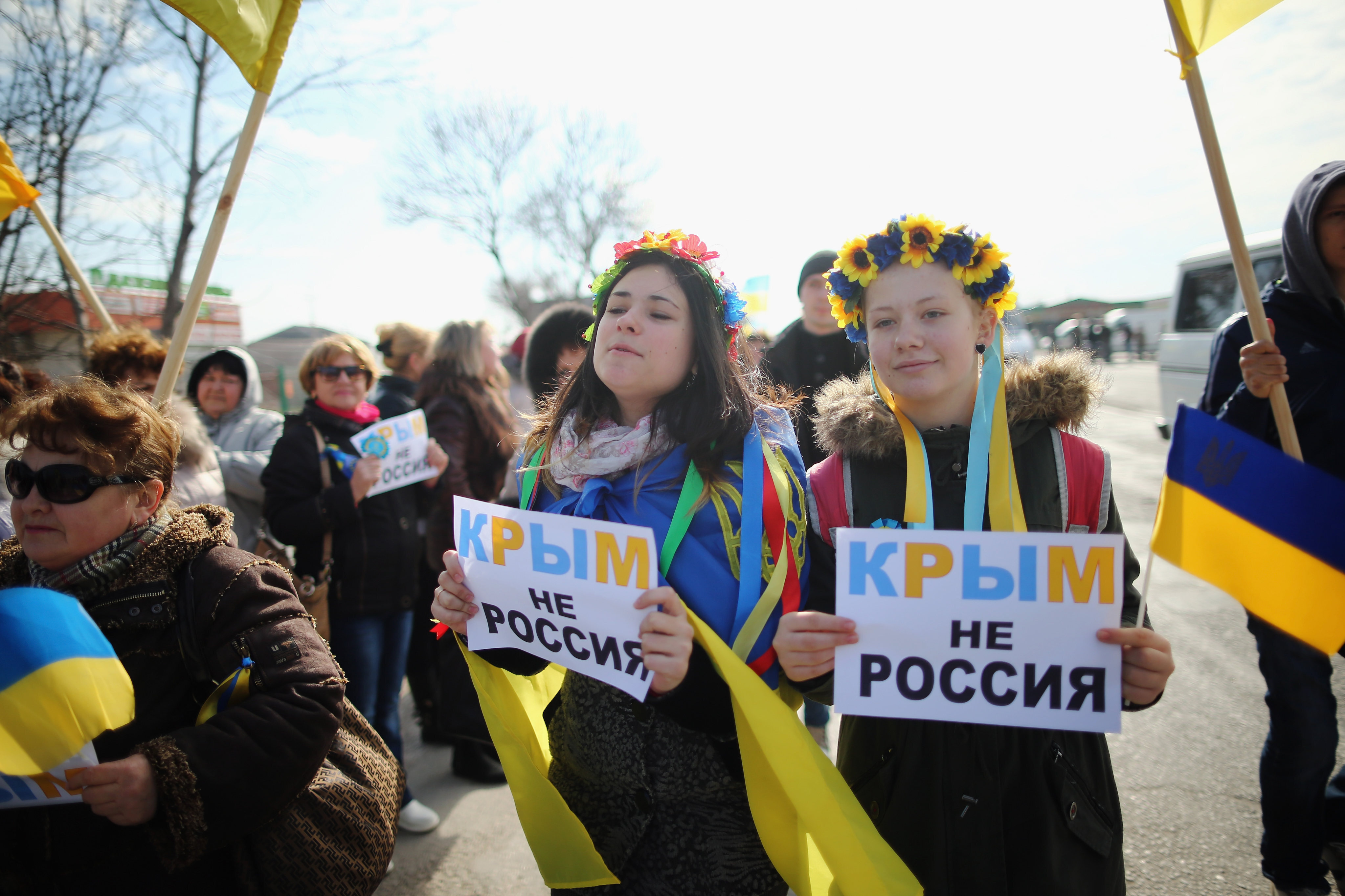 Two young Ukrainian women hold signs that read “Ukraine not Russia” in Crimea in 2014 after the territory’s annexation by Russian forces. Photo: Getty Images