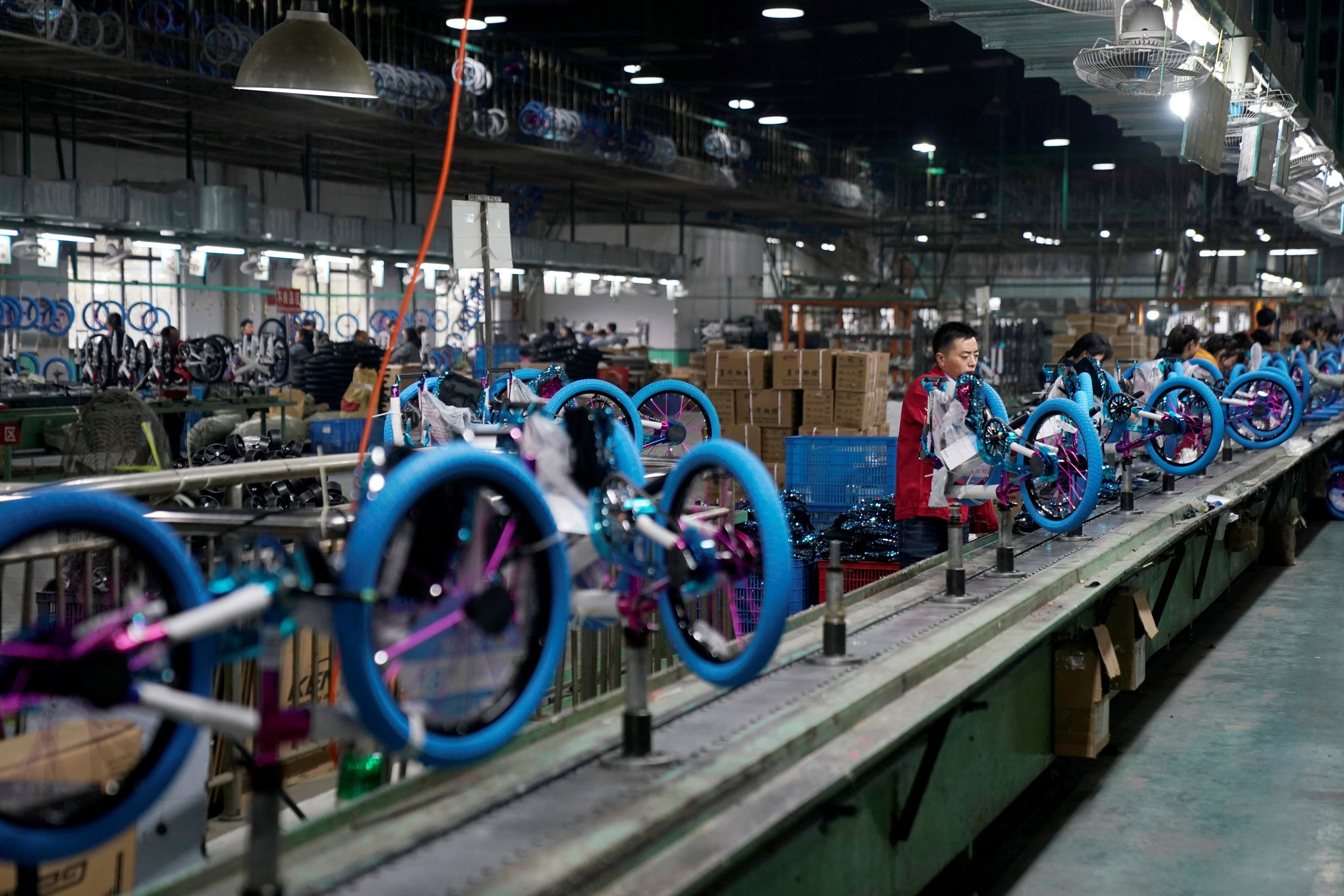 Employees on the production line of Kent bicycles at Shanghai General Sports in Kunshan on February 22, 2019. Photo: Reuters