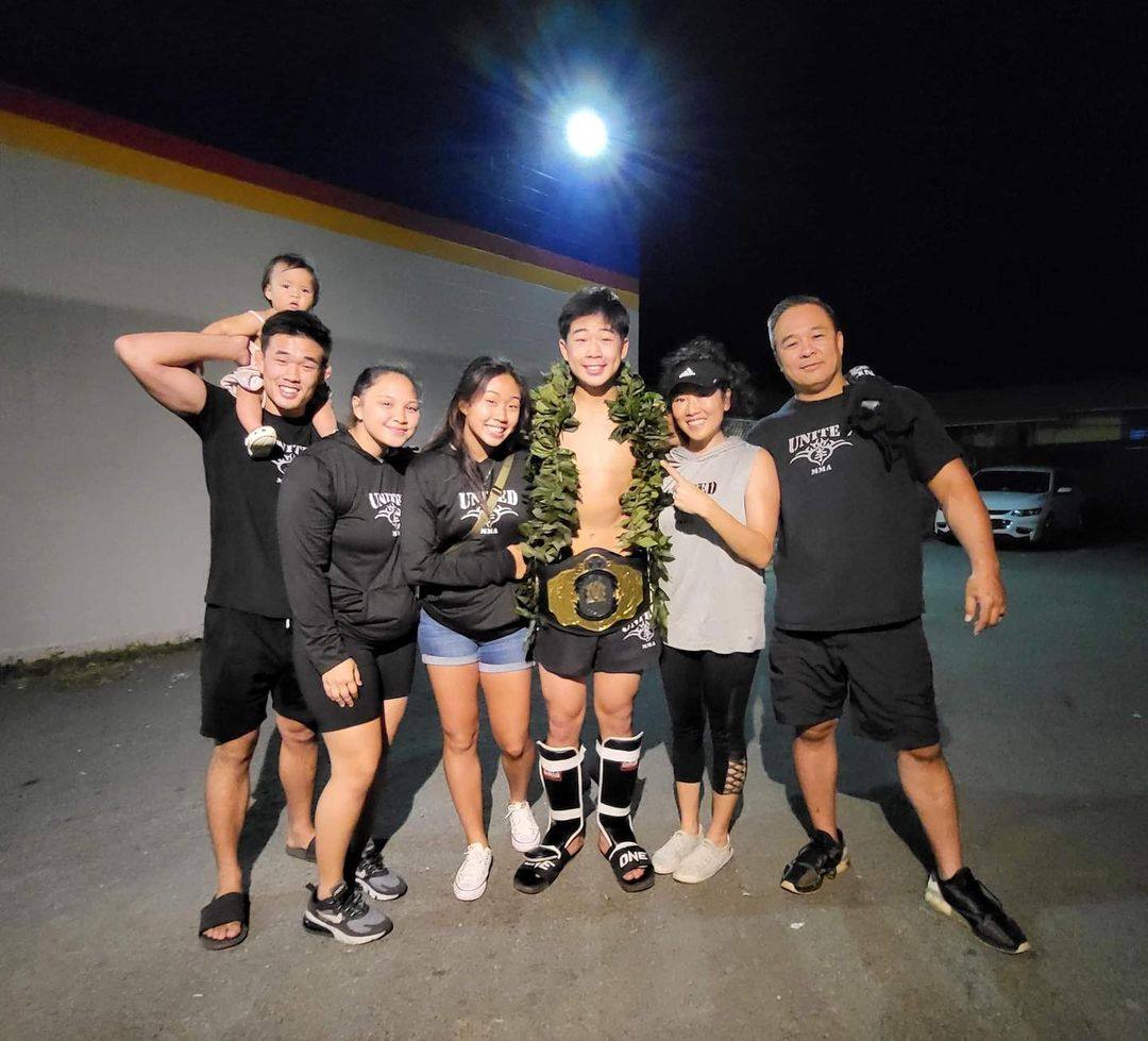 Adrian Lee celebrates winning a junior kick-boxing title alongside his family, including former ONE lightweight champion Christian Lee (left) and rising atomweight contender Victoria Lee (third left). Photo: Adrian Lee/Instagram