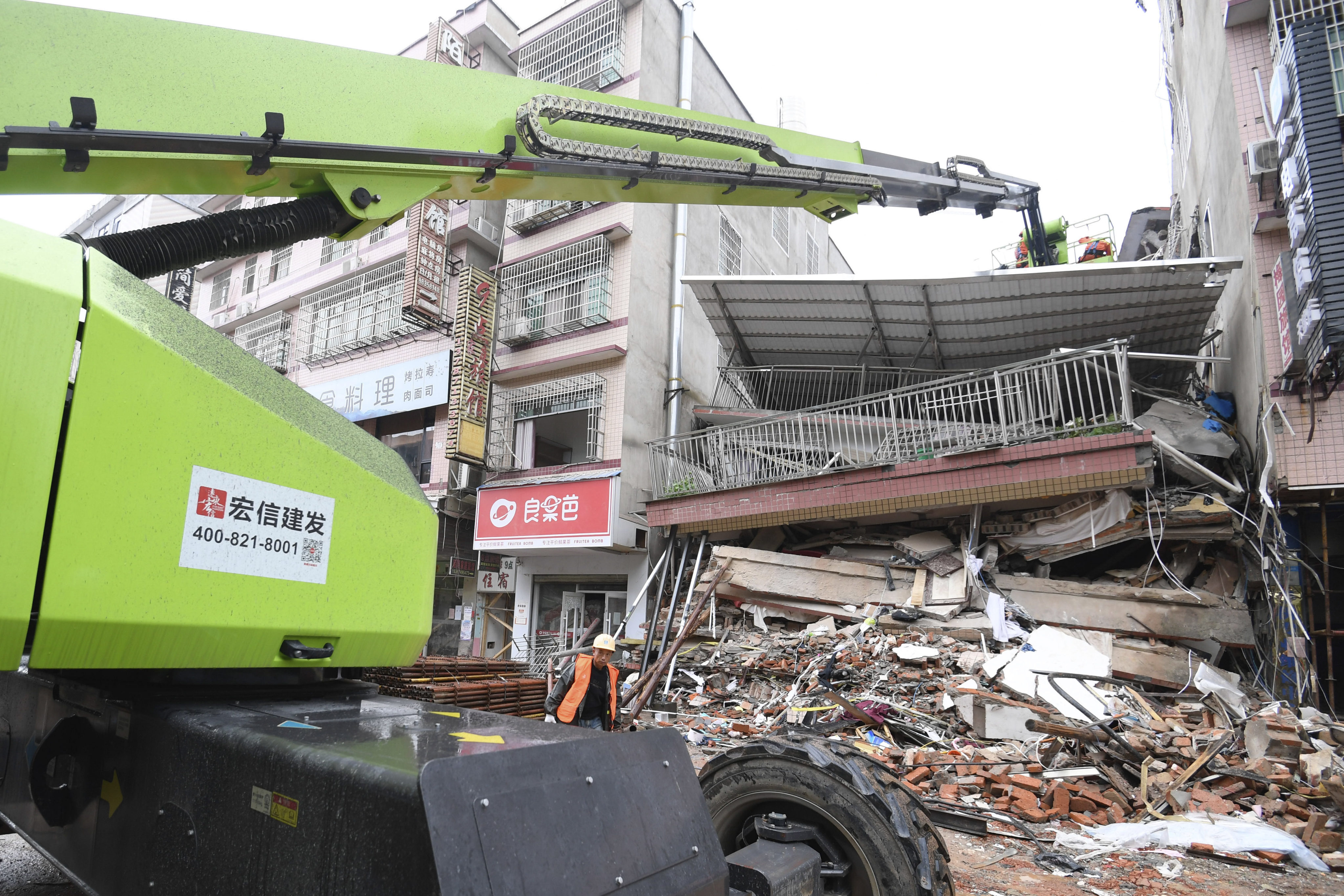 The  building came down on Friday, killing at least two people. Dozens are missing. Photo: Xinhua via AP