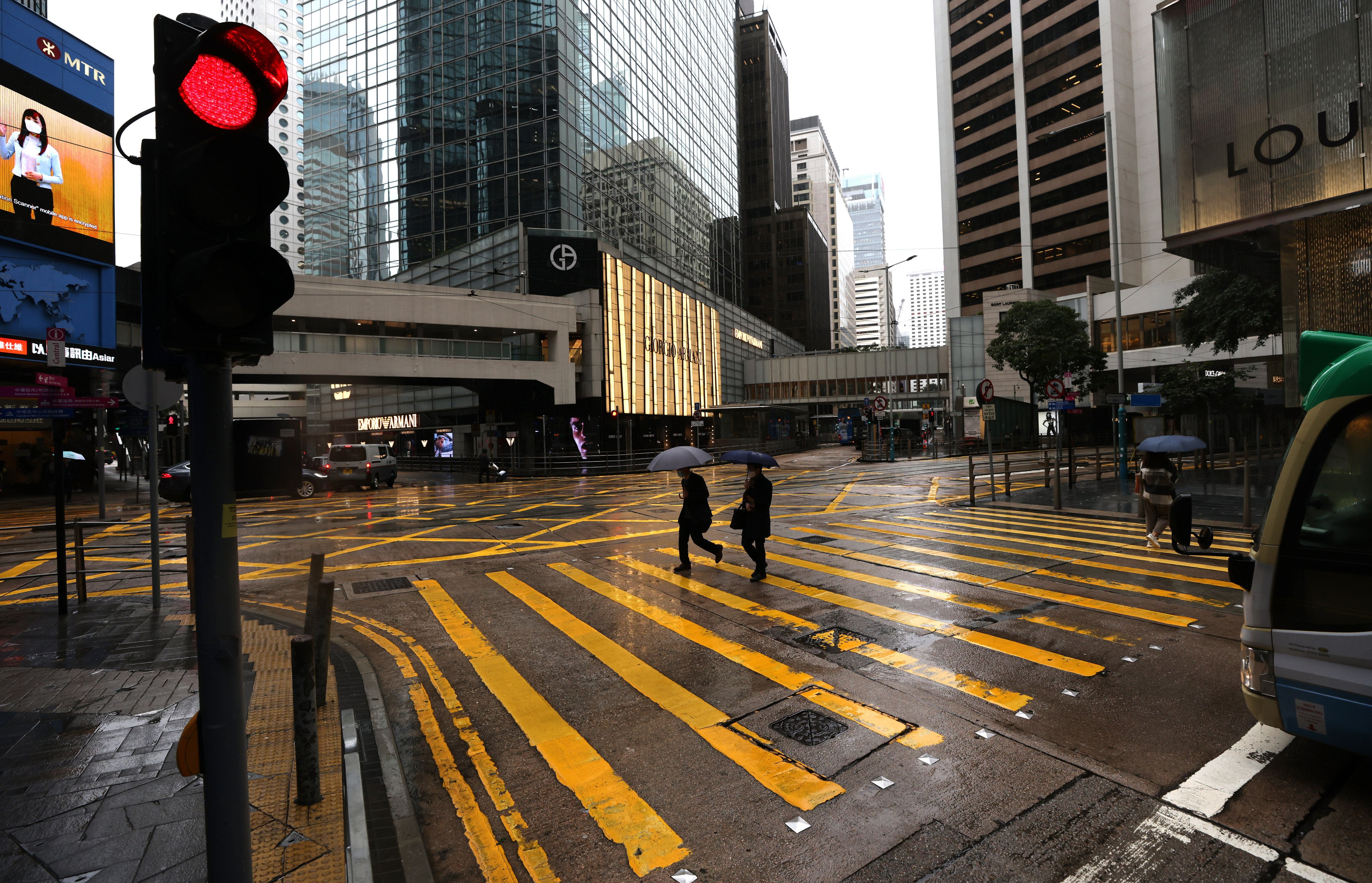 A street in Hong Kong’s Central business district is quiet on a rainy afternoon on February 21. The pandemic and ensuing restrictions have led many to re-examine their career path and identity. Photo: Nora Tam