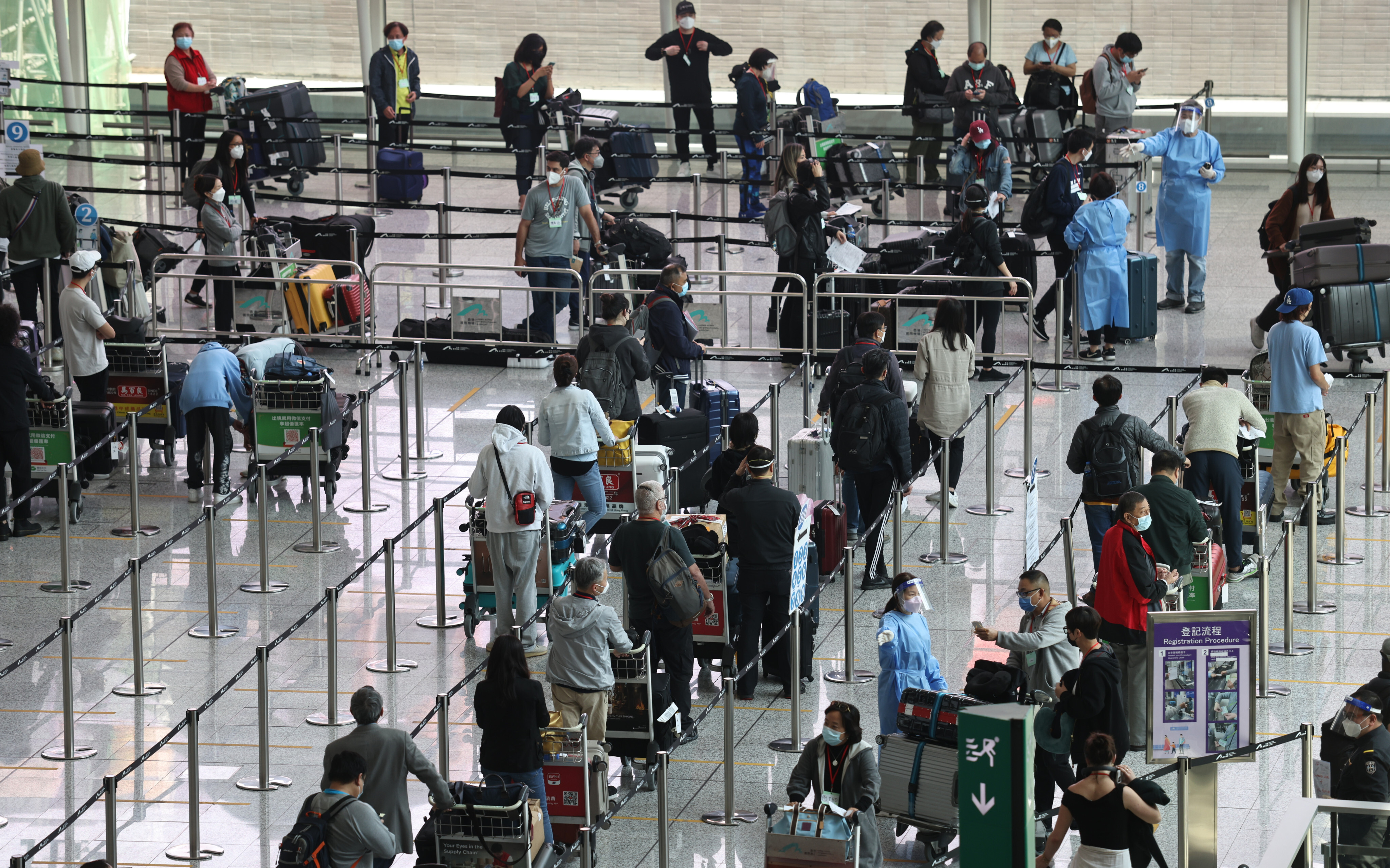 Passengers arriving at Hong Kong International Airport queue to take Covid-19 tests before heading to their quarantine hotels on May 3. More flights are expected to arrive after the government eased some travel restrictions. Photo: K.Y. Cheng