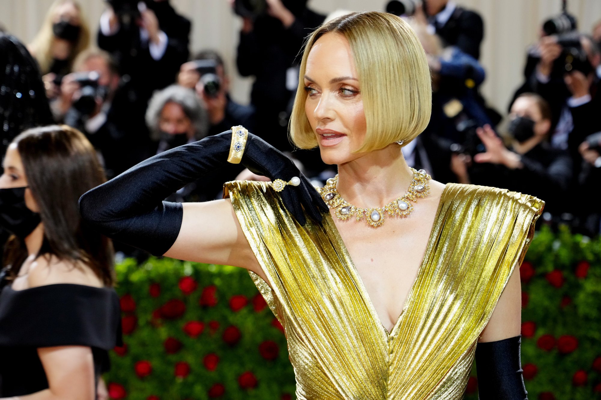 Model Amber Valletta dripped in gold on the Met Gala red carpet 2022, on May 2, in New York. Photo: FilmMagic