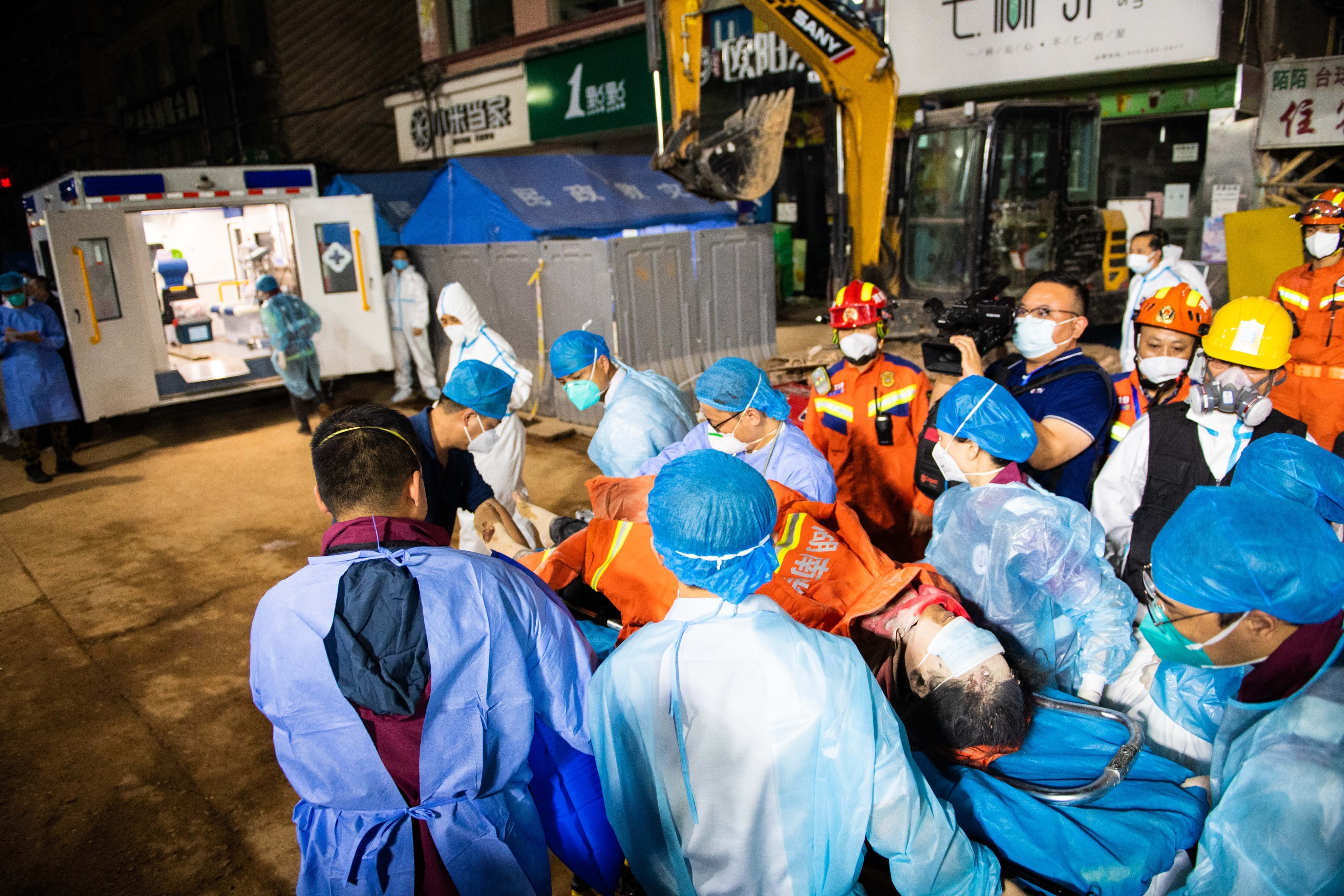 A woman has been found alive after nearly six days trapped in the rubble of a six-story building in Changsha, central China. Photo: Xinhua