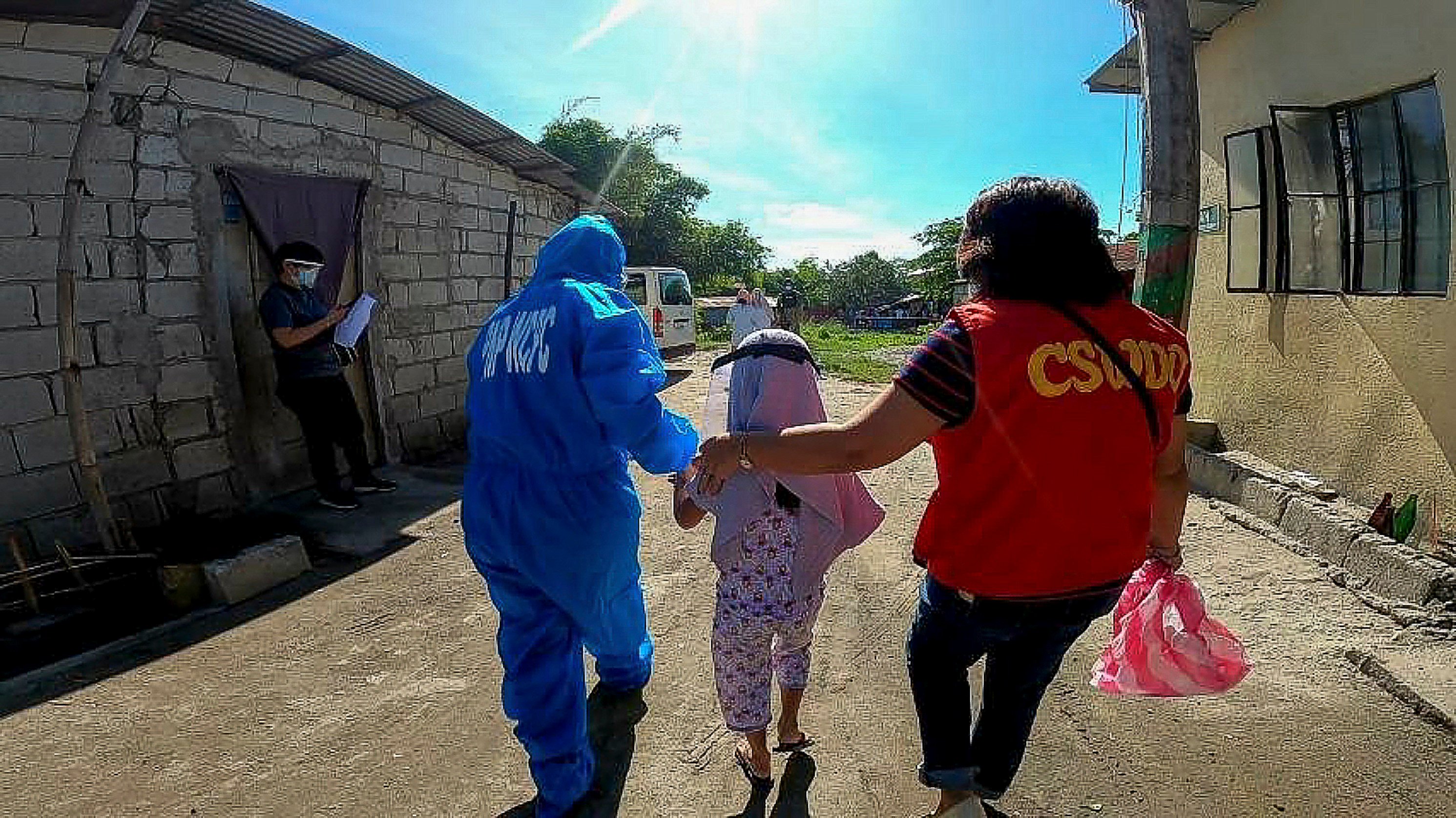A child suspected to have been abused online is rescued in an operation in Angeles City, the Philippines, in February 2021. Nine children were rescued and one woman arrested. Photo: Red Door News/Australian Federal Police