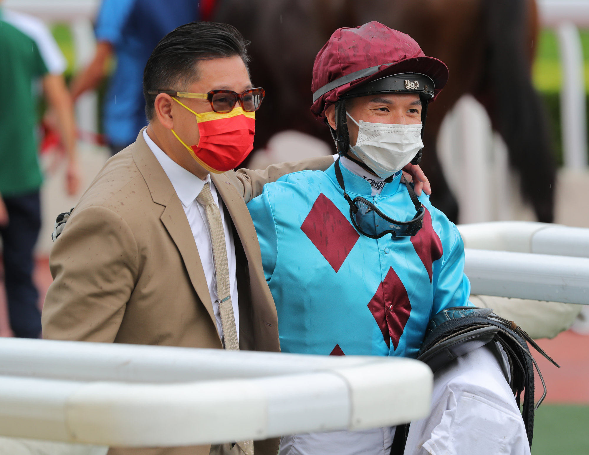 Trainer Dennis Yip and jockey Victor Wong celebrate Faulds’ success.