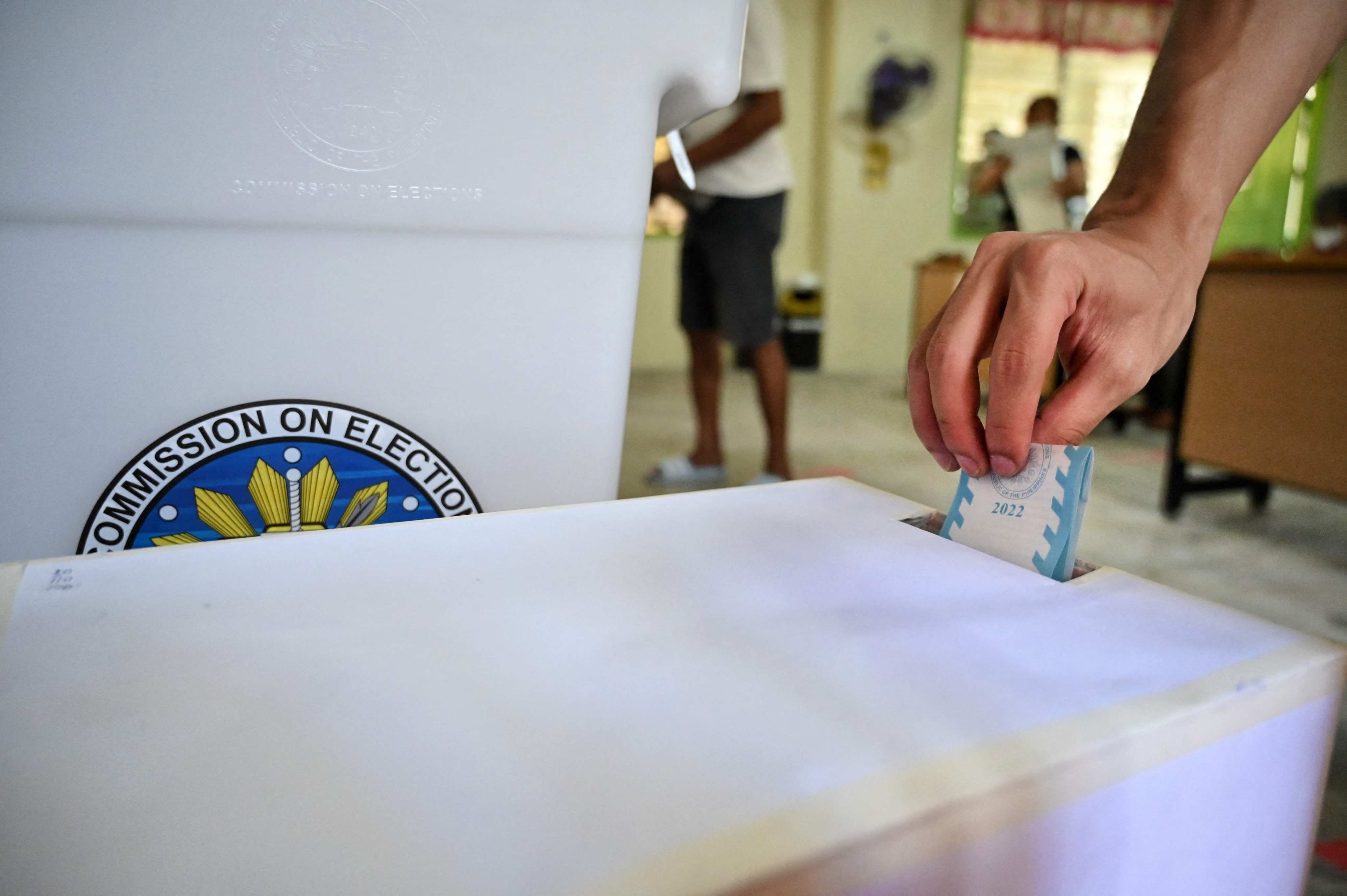A man casts his vote on Monday at a polling station in Manila for the Philippines’ presidential election. Photo: AFP