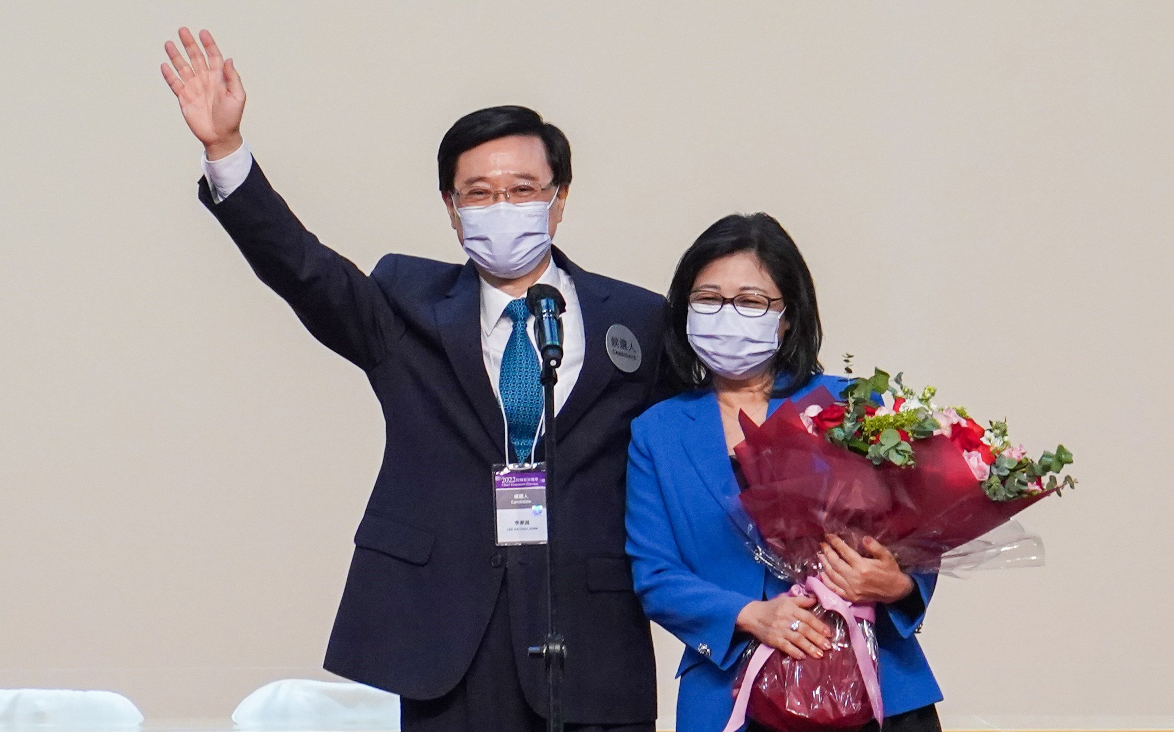 Chief Executive-elect John Lee shares the stage with his wife Janet Lam on Sunday. Photo: Sam Tsang