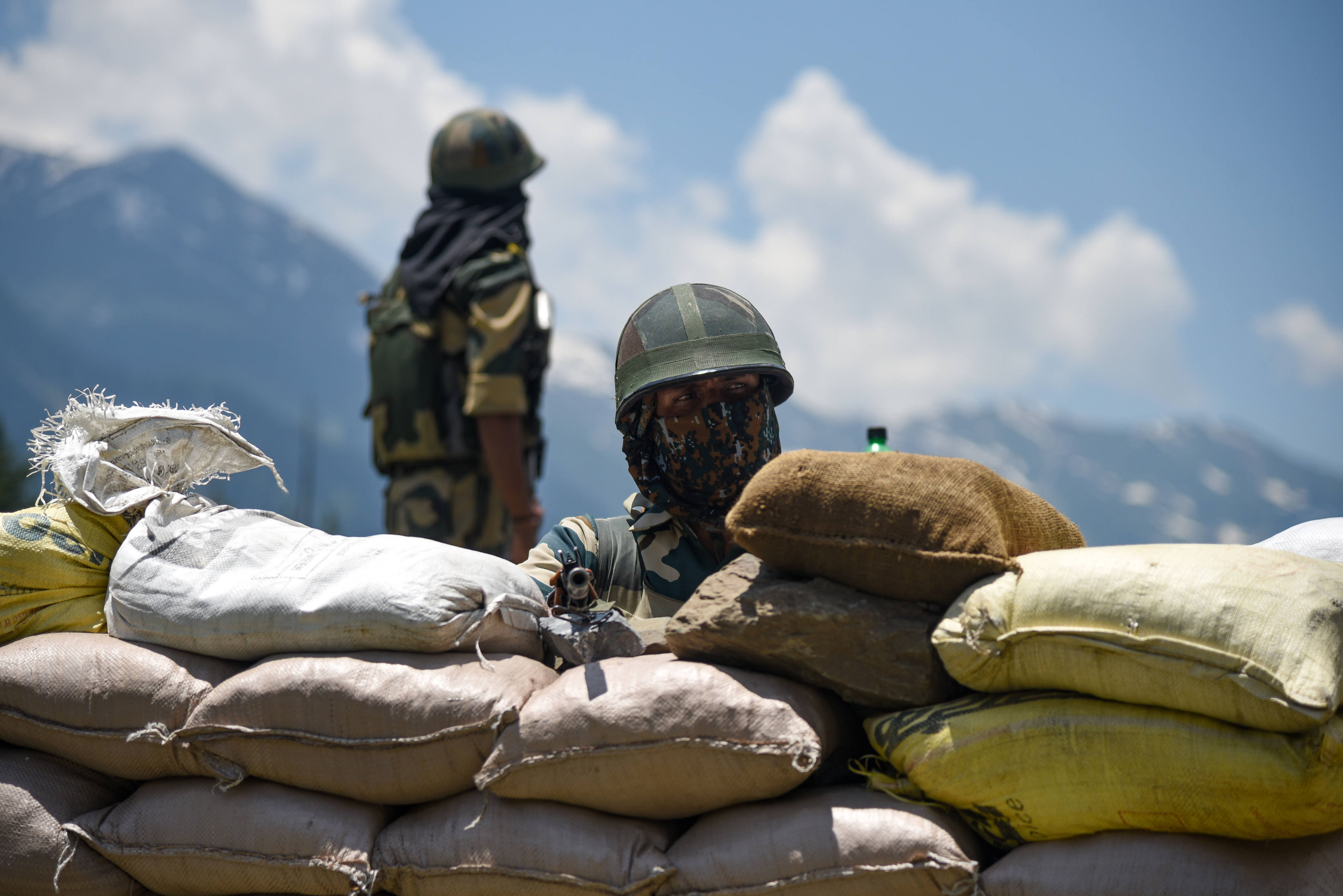 A soldier of the Indian Border Security Force (BSF) guards a national highway leading to Ladakh region. Photo: dpa