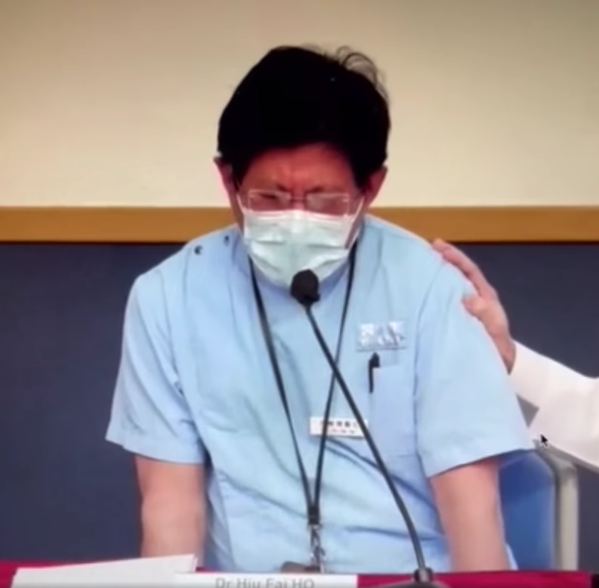 Dr Ho Hiu-fai breaks down in tears during a meeting at Queen Elizabeth Hospital on March 9. Photo: Facebook