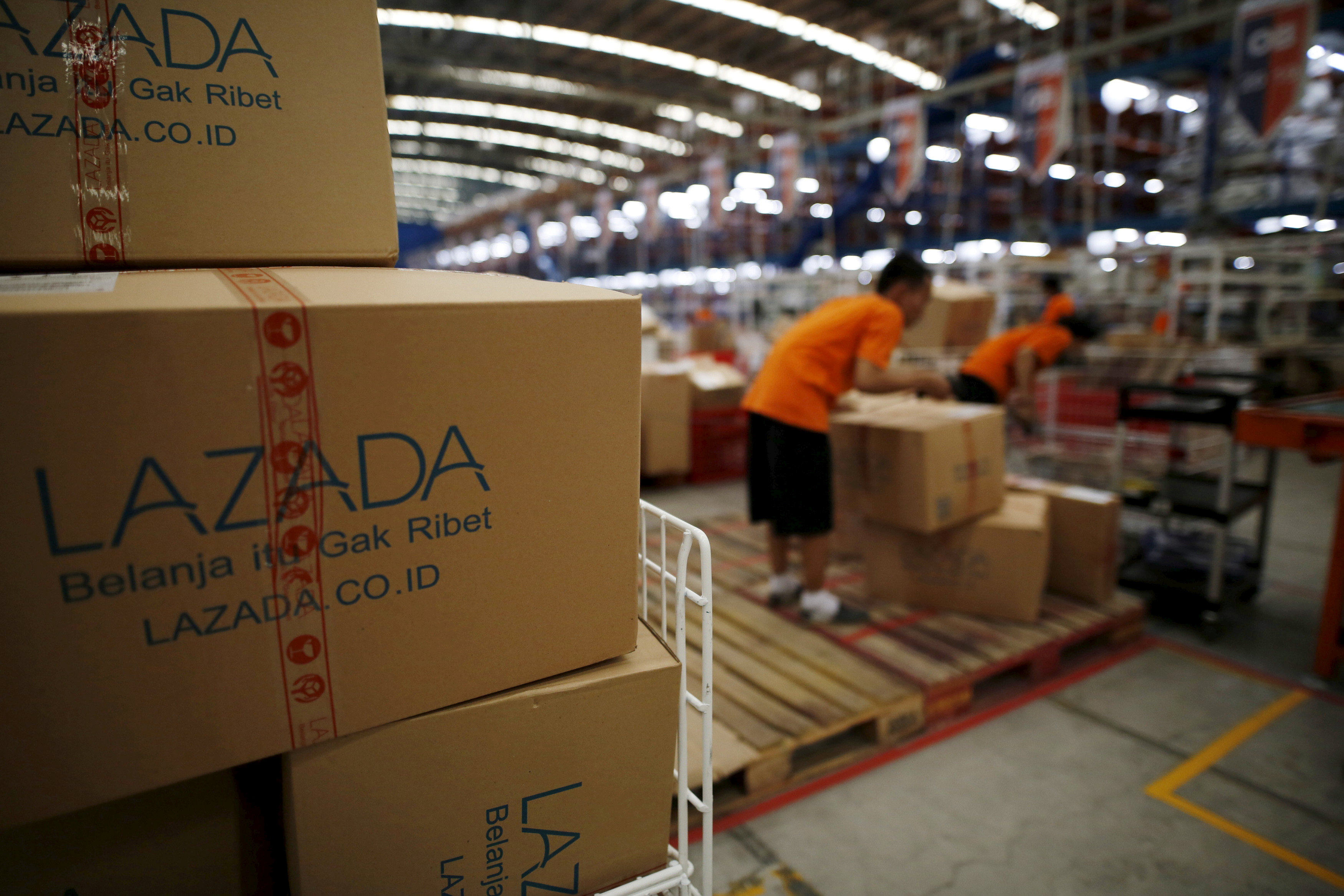 Employees at online retailer Lazada fill orders at the company’s warehouse in Jakarta, Indonesia. Photo: Reuters