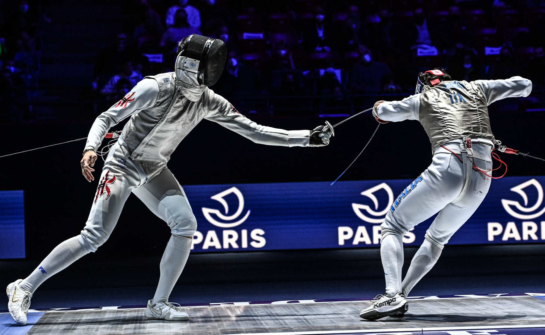 Cheung Ka-long (left) defeats Edoardo Luperi of Italy in the World Cup in Paris early this year. Photo: FIE
