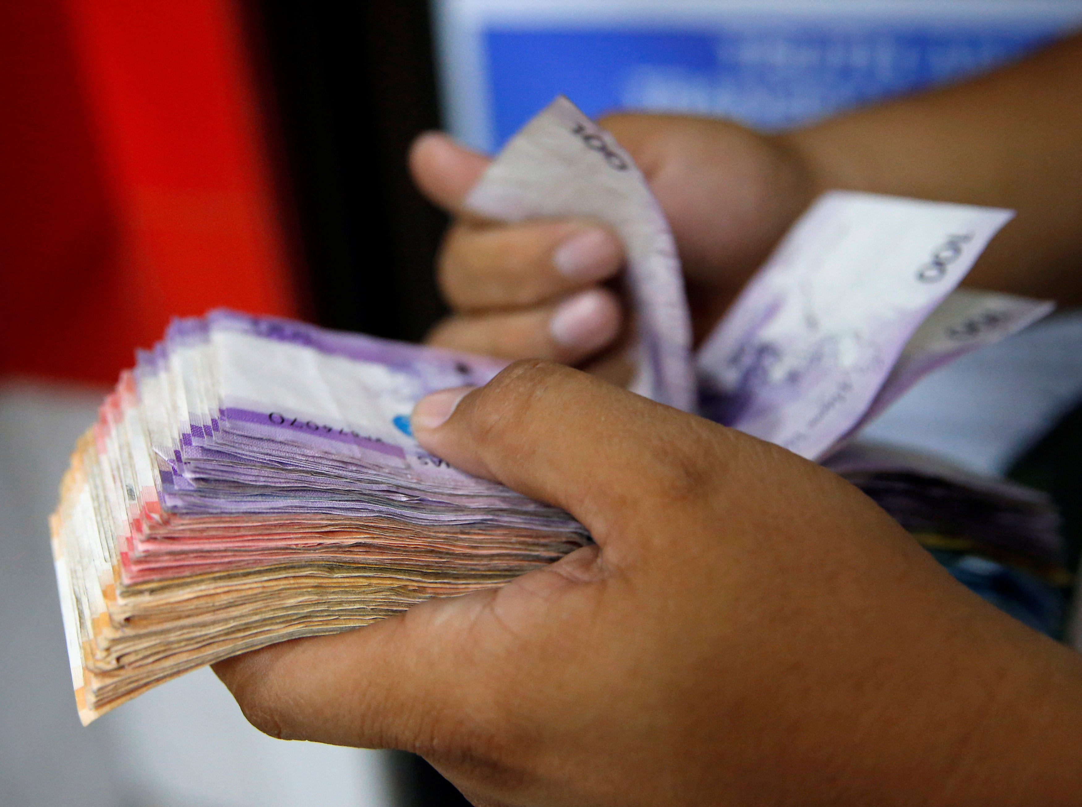Filipinos should see a few more pesos in their wages soon. Photo: Reuters