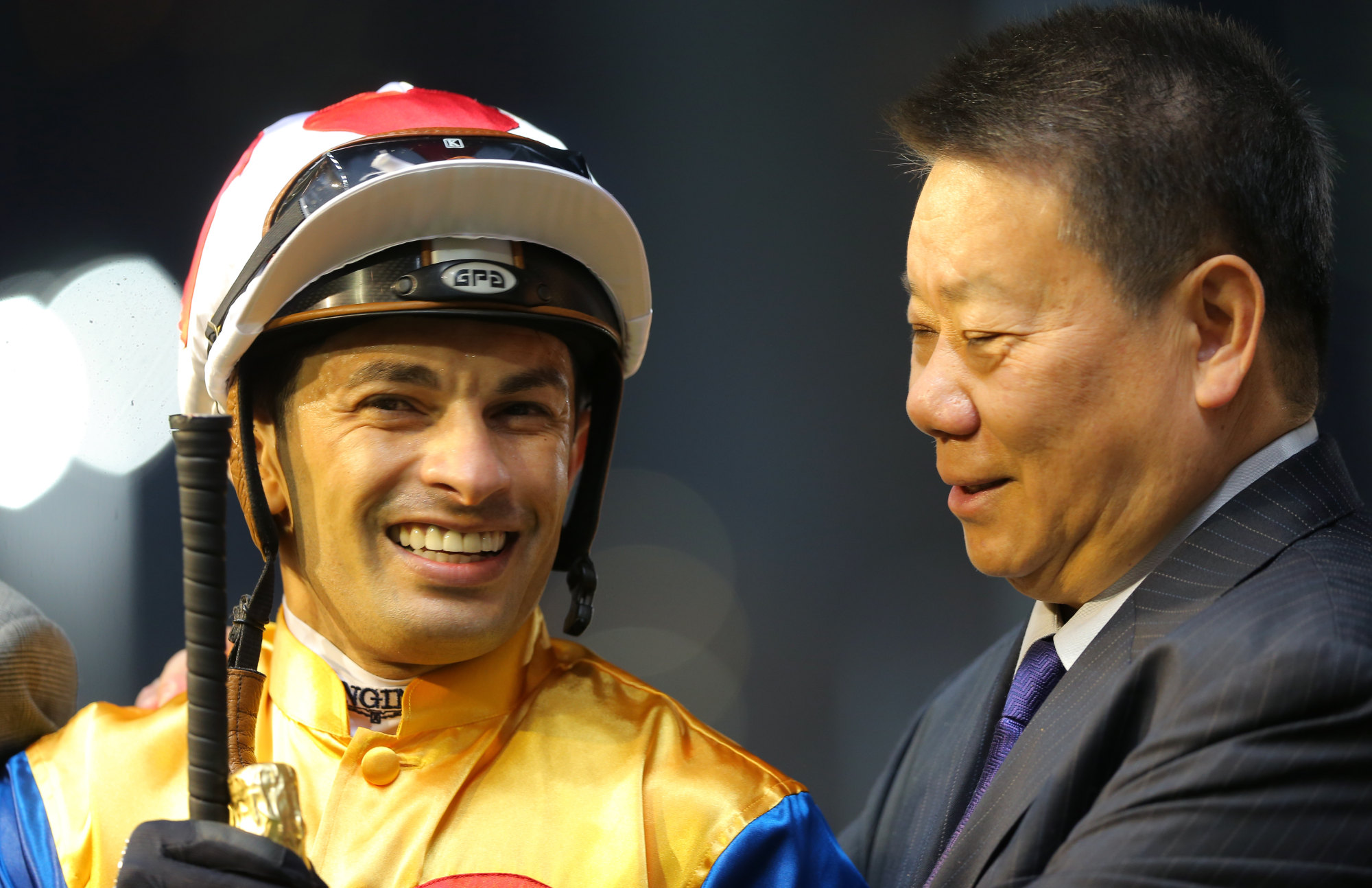 Jockey Silvestre de Sousa celebrates a winner with trainer Manfred Man in 2020.