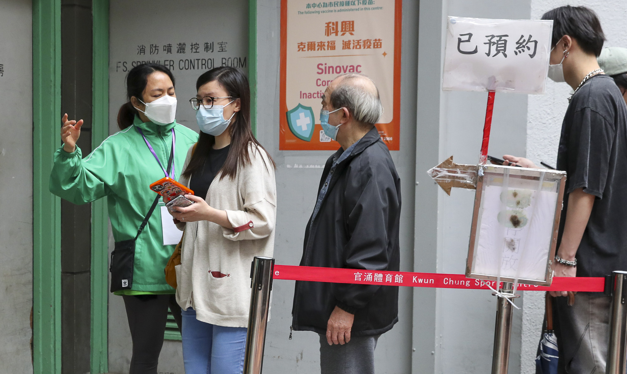 Residents queue to get vaccinated at the Kwun Chung Municipal Services Building. Photo: Edmond So