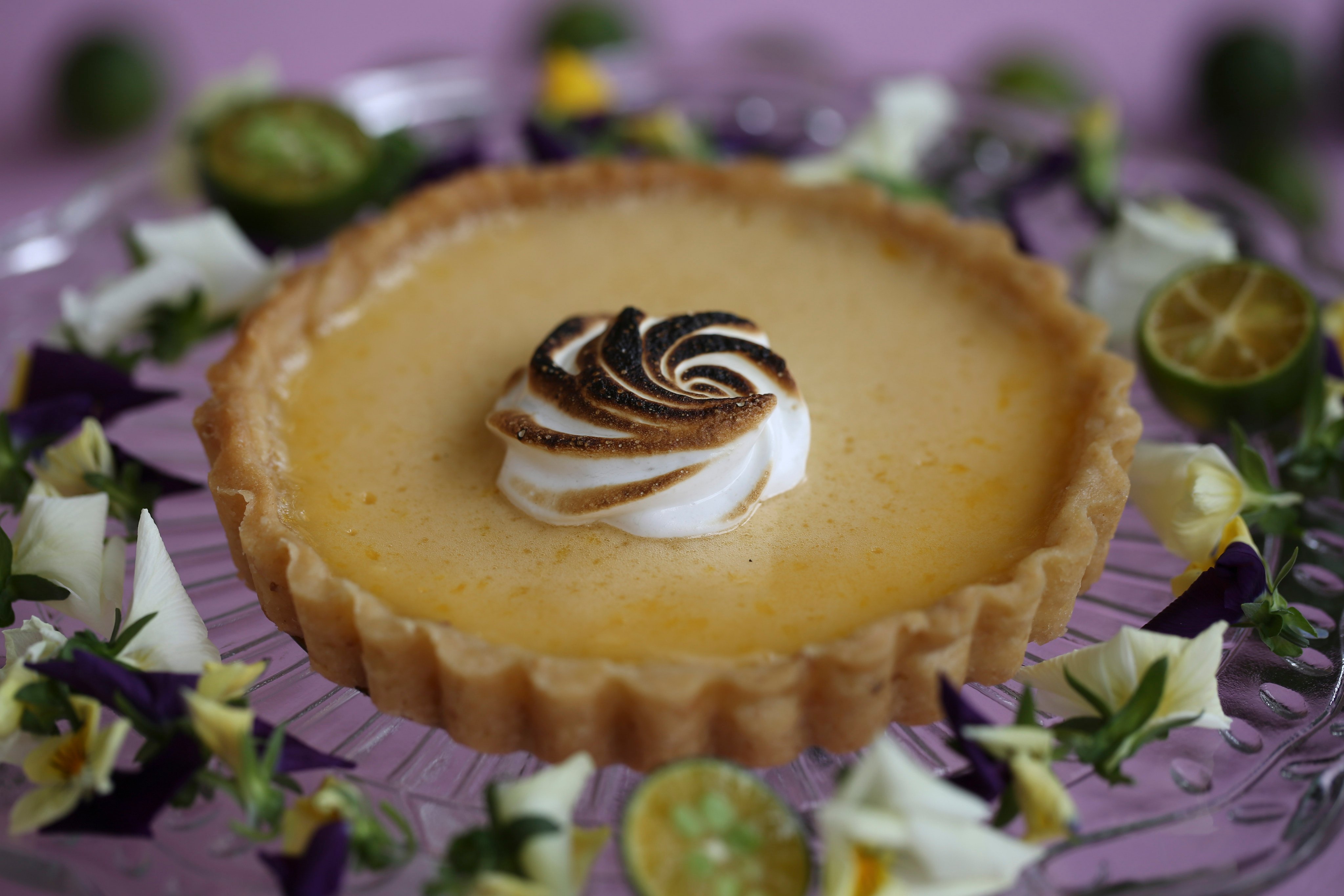 How to make a refreshing calamansi and crème fraîche tart with macadamia crust and meringue. Photo: Jonathan Wong