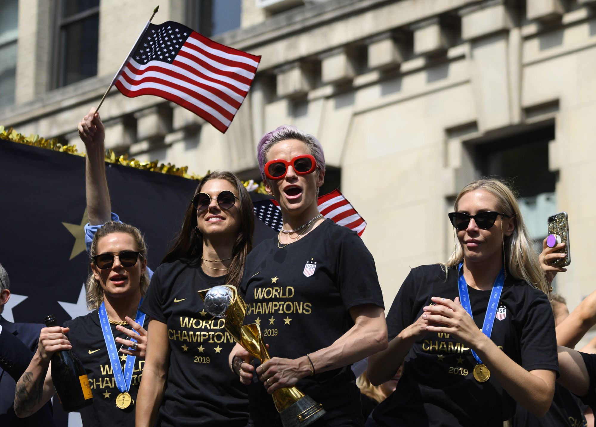 Megan Rapinoe (centre) and other members of the 2019 World Cup-winning US women’s team take part in a ticker-tape parade in New York. Photo: AFP