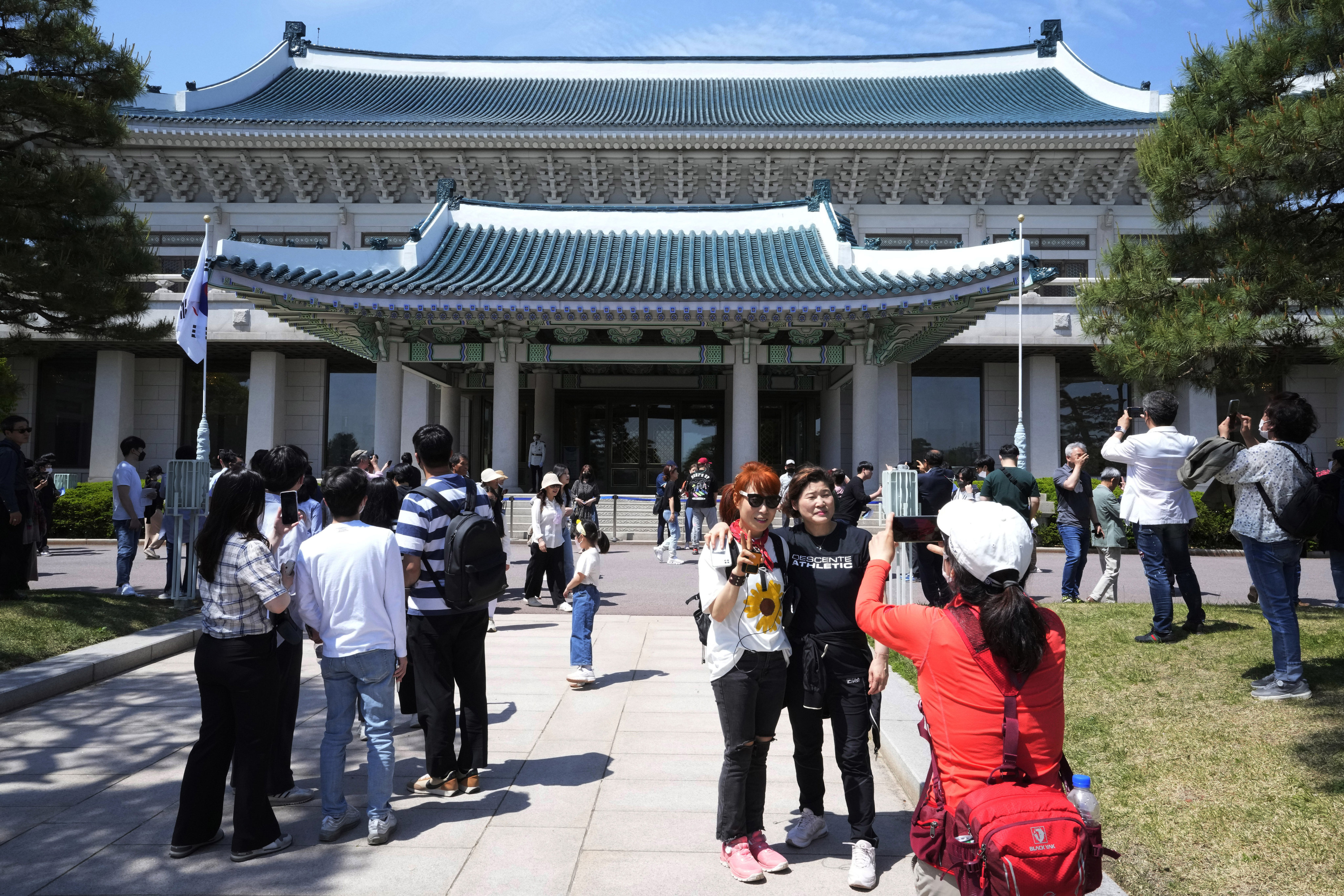 People visit the Blue House in Seoul on Tuesday after South Korea’s former presidential palace was opened to the public for the first time in 74 years. Photo: AP