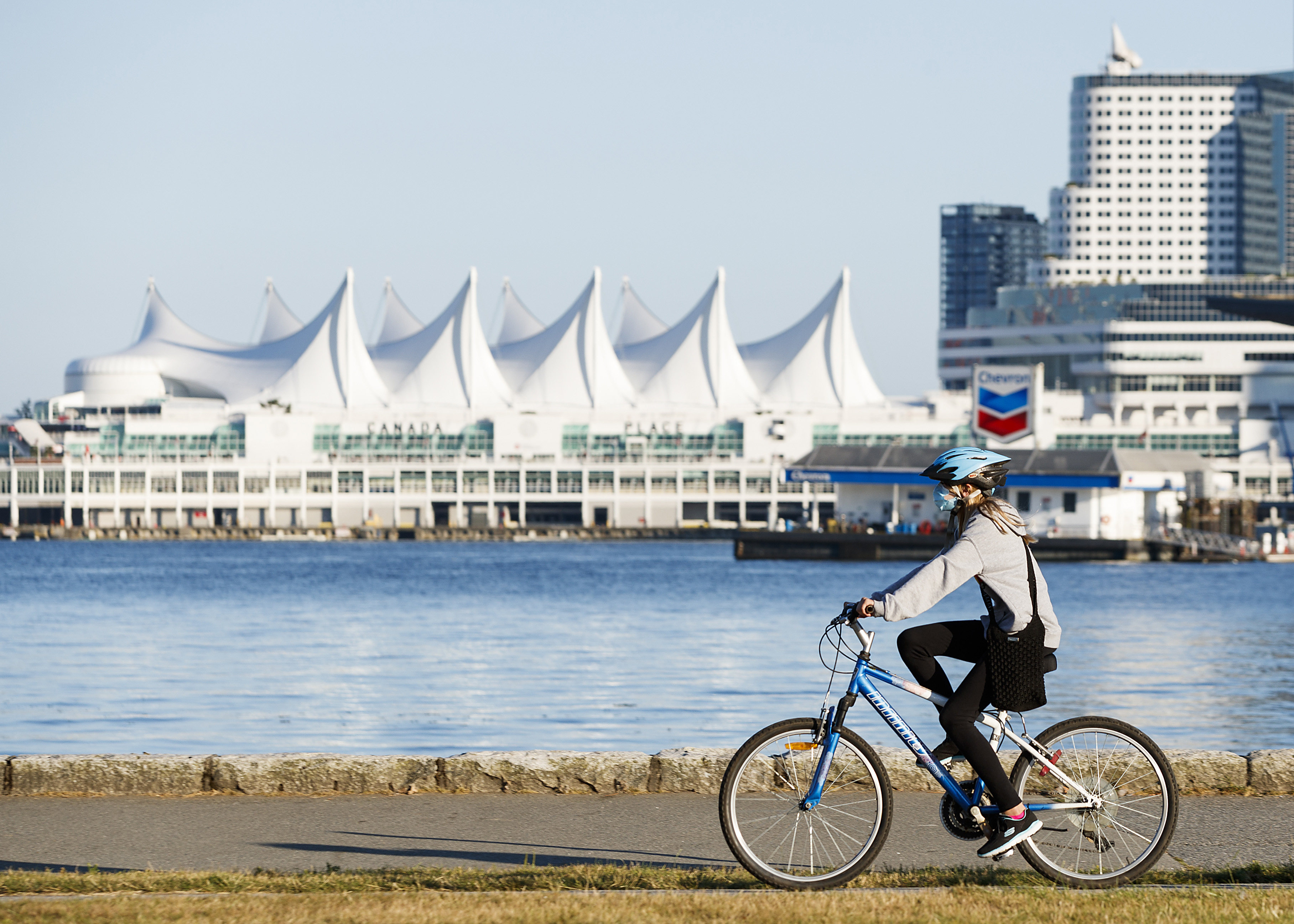 As Covid-19 restrictions ease around the world, Asian-Canadian millennials talk about their future travel plans. Above: a woman cycles along the seawall at Stanley Park in Vancouver, Canada. Photo: Andrew Chin/Getty Images