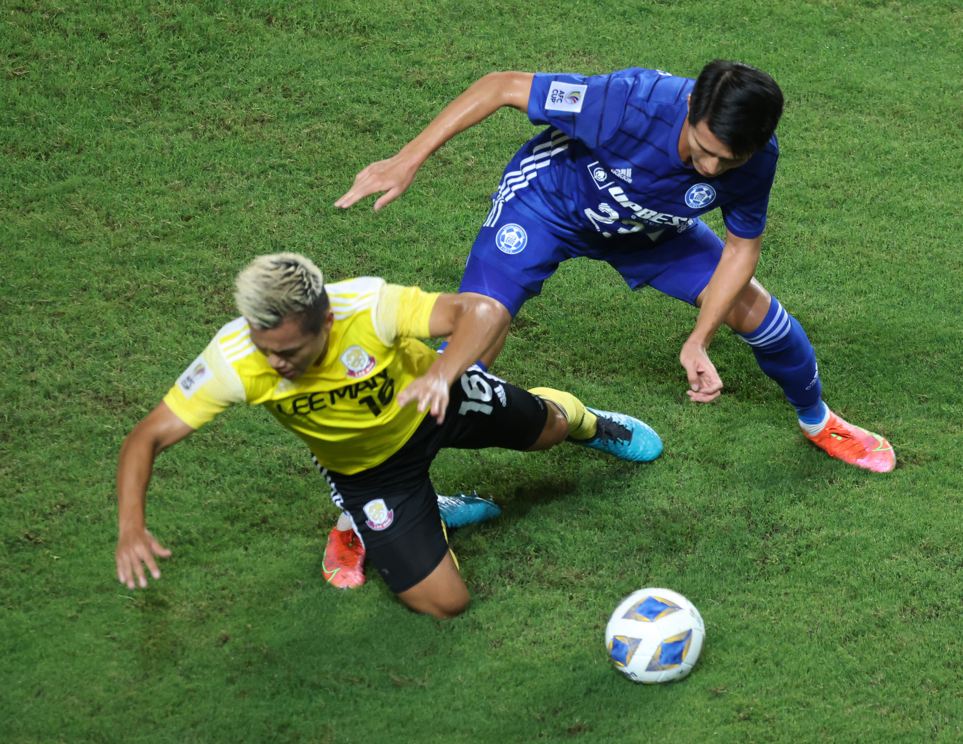 Lee Man’s Ngan Lok-fung (left) battles for the ball with Eastern Long Lions’ Wong Wai during their AFC Cup Group J match at Hong Kong Stadium on June 23, 2021. Photo: K. Y. Cheng
