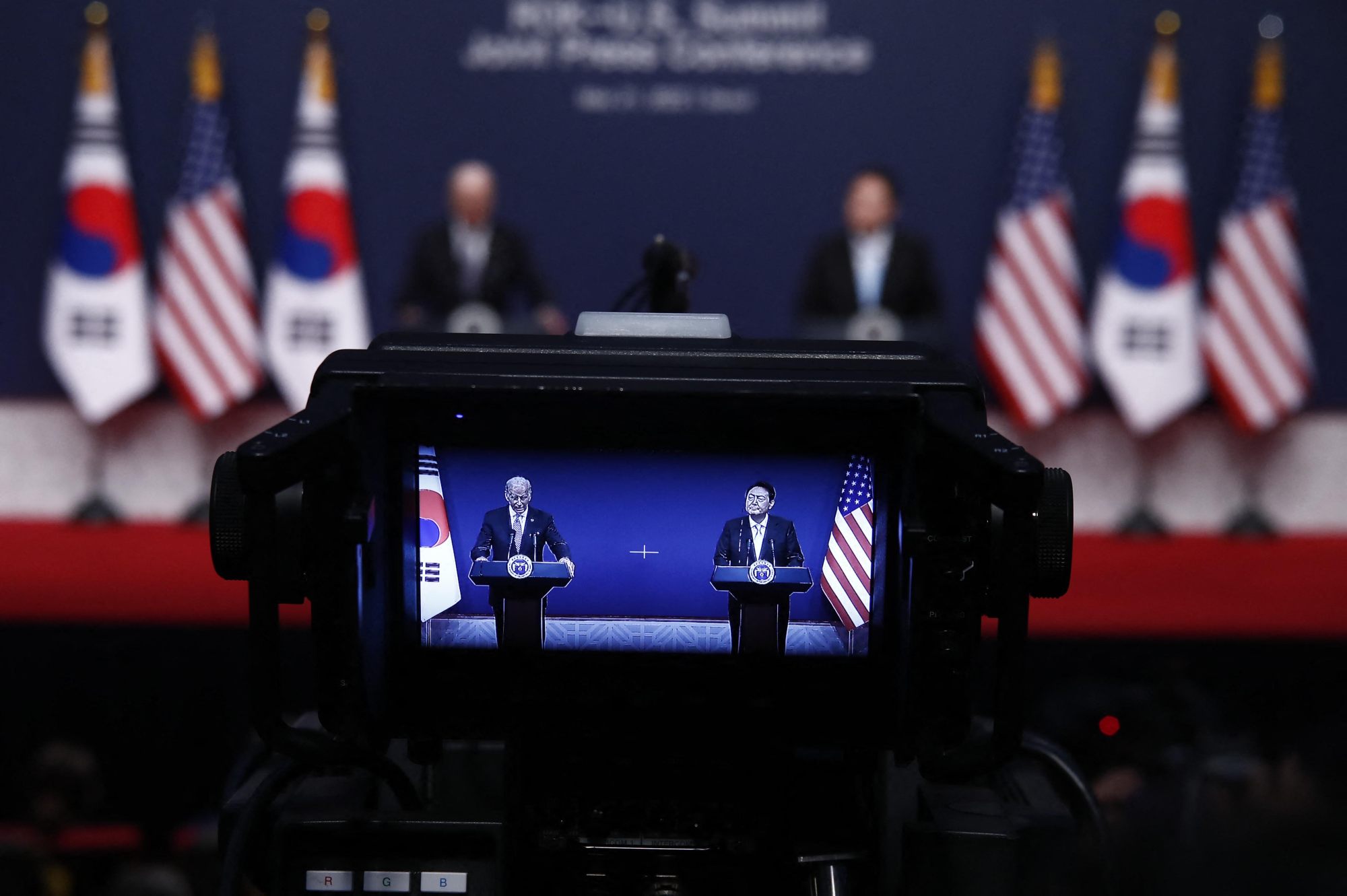 A view of a video camera screen showing US President Joe Biden (left) speaking with South Korean President Yoon Suk-yeol (right) during a joint press conference on Saturday. Photo: AFP